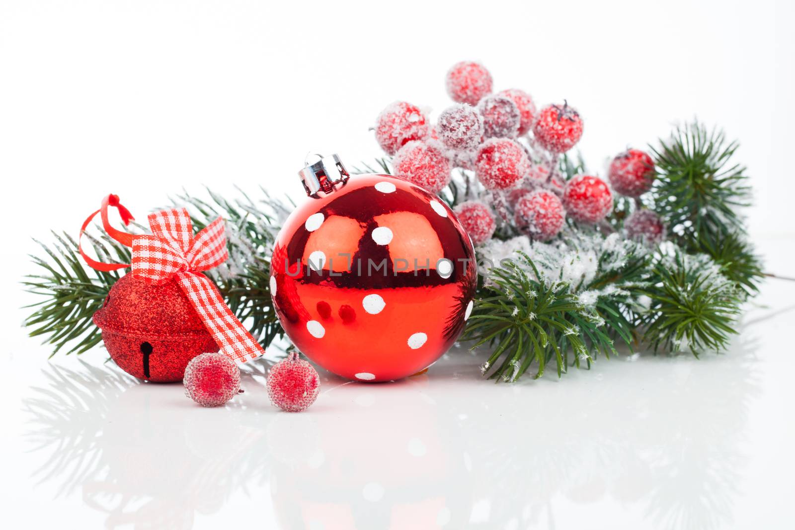 Christmas balls and fir branches with decorations isolated over white