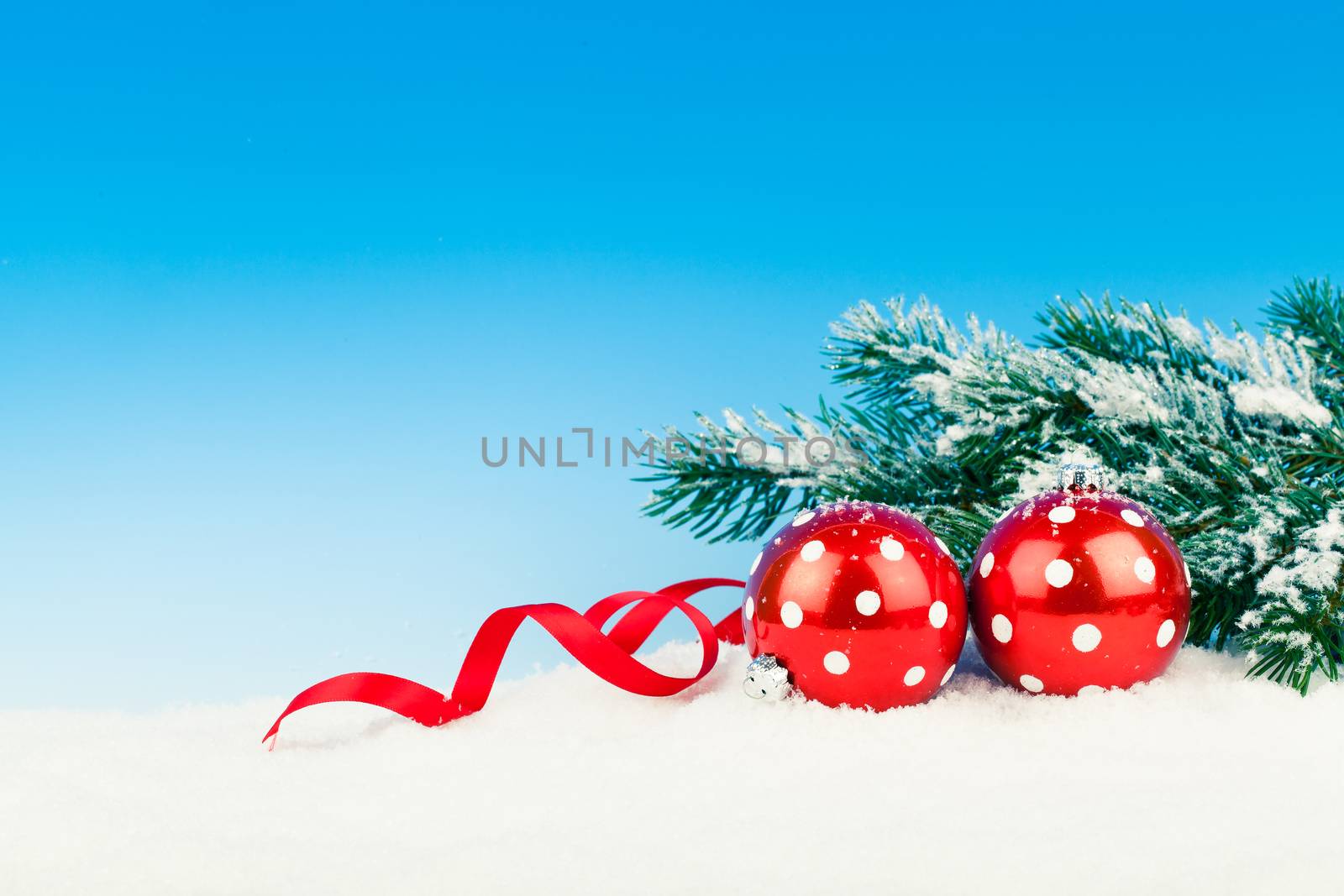 Christmas decoration over snow, blue background