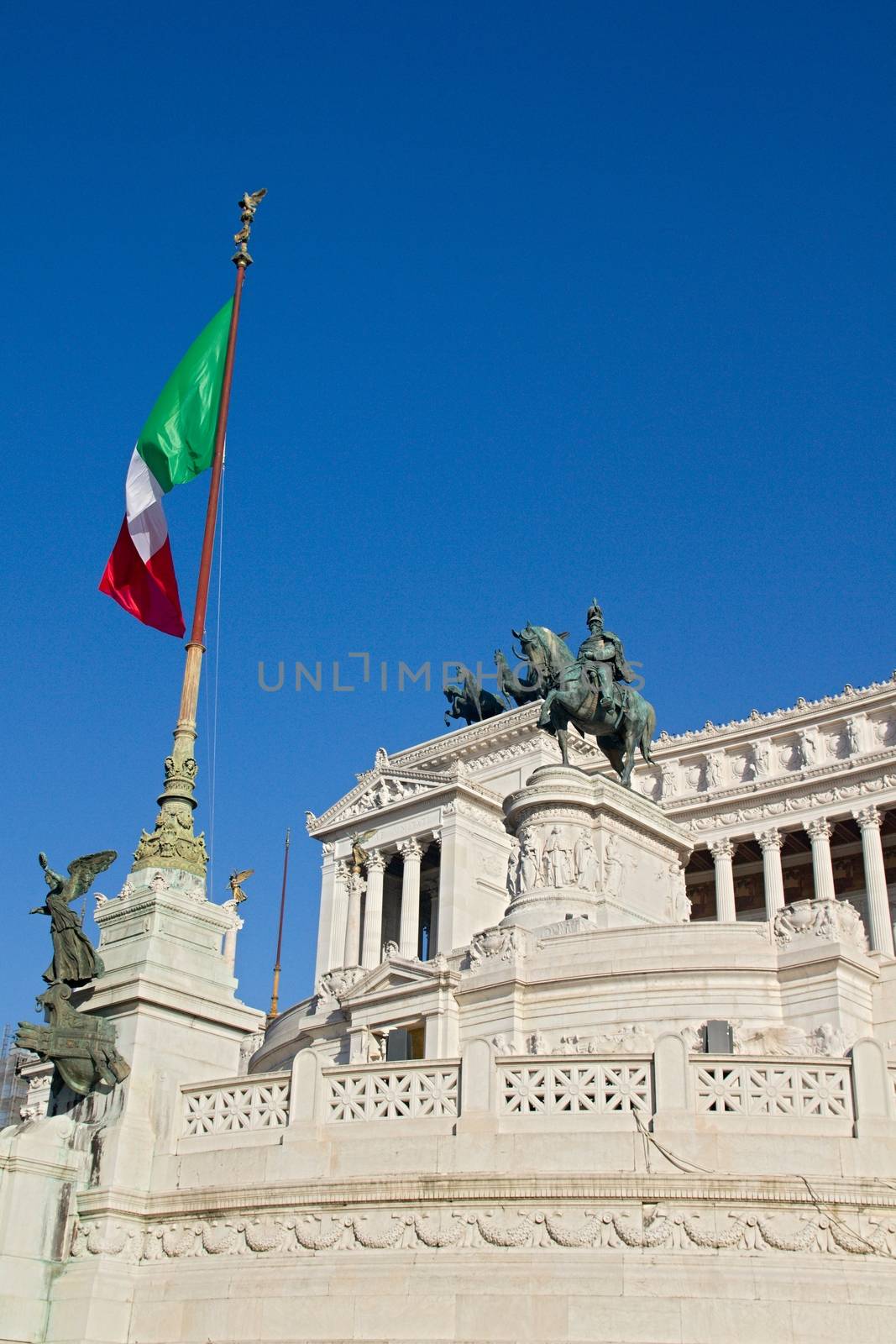 Photo shows Rome cityscape with houses and roofs.