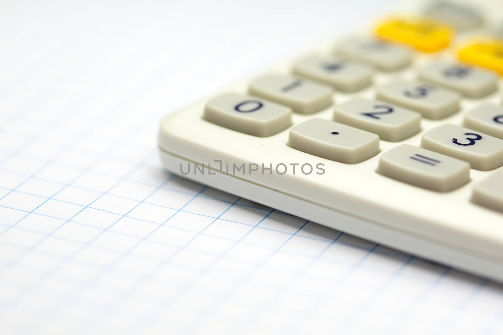 Photo shows a closeup of business calculator on a paper.