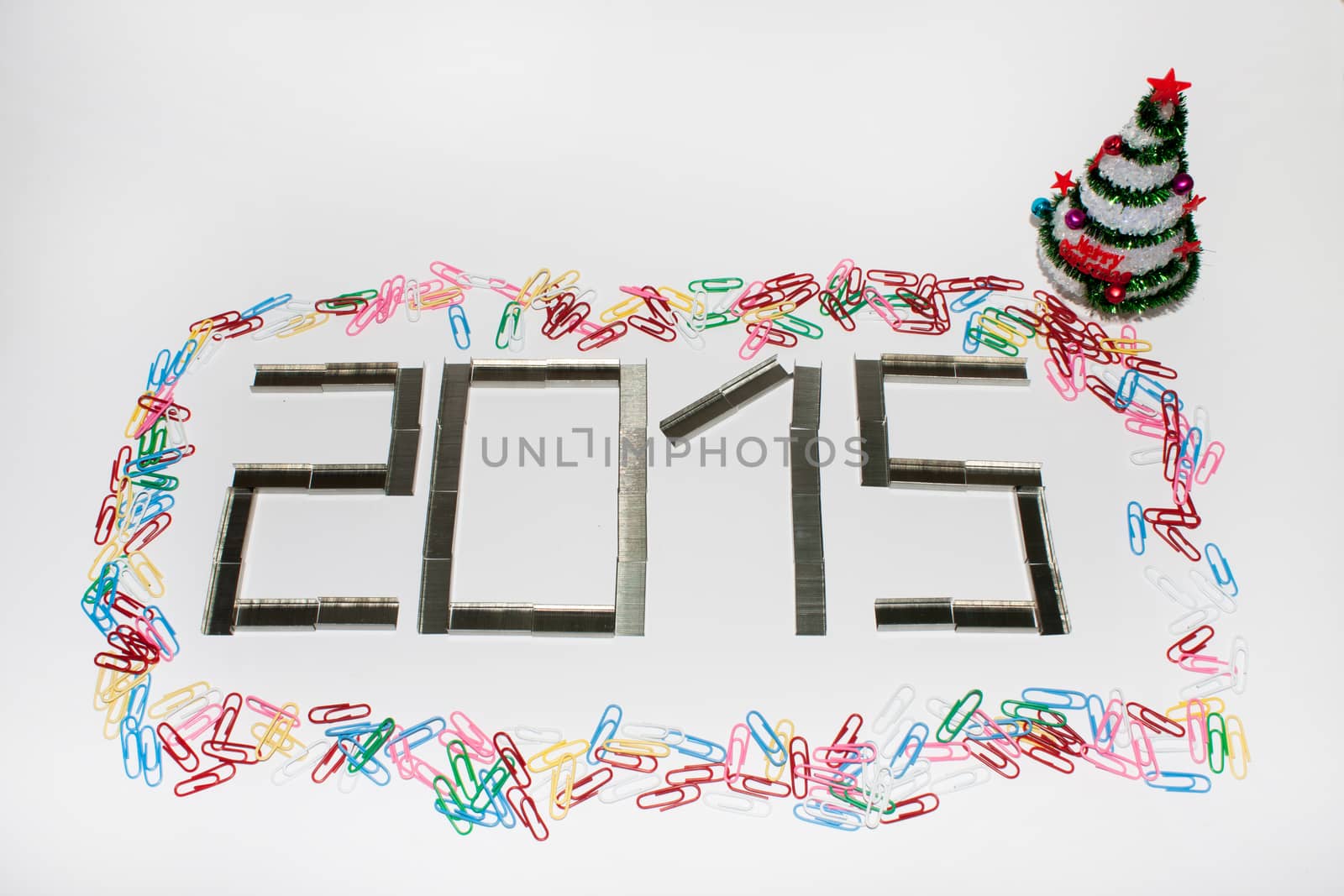 Happy new 2015 year with staples on the white background.