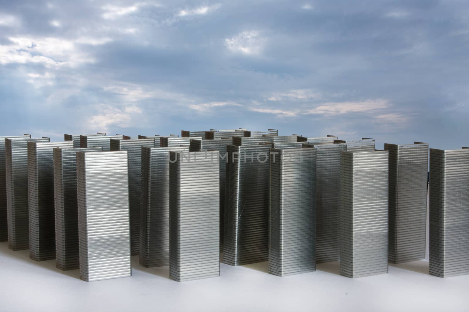 Staples as city buildings with blue sky. Abstract image for commercial and business ad.