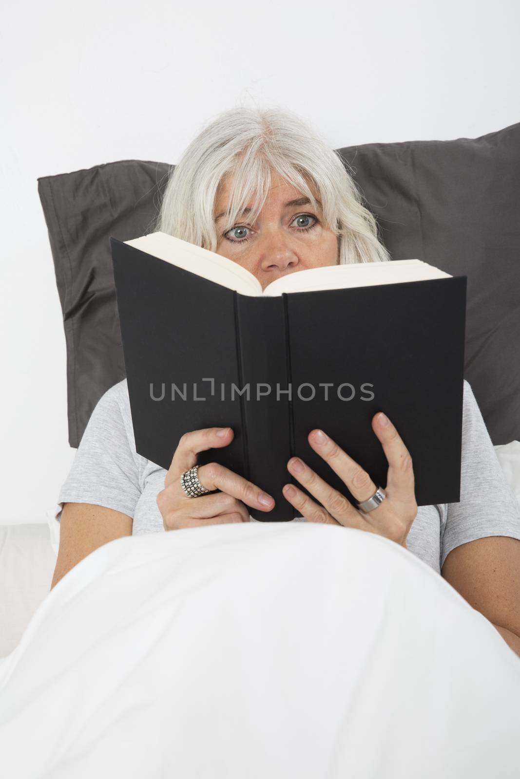 Woman Absorbed by the book by gemenacom