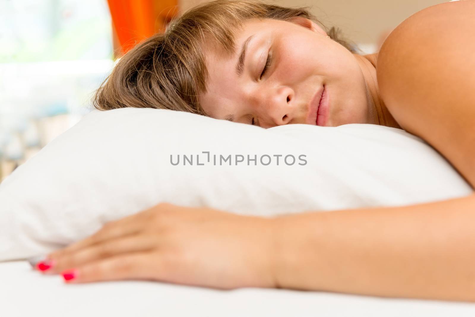 young girl sleeps in the bedroom afternoon