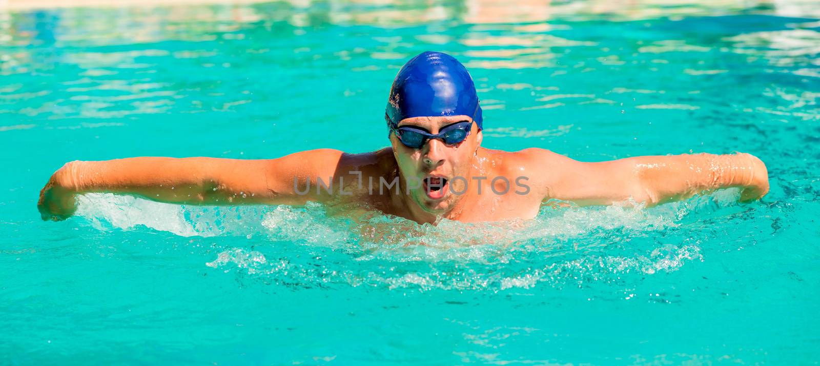 portrait of a young swimmer going in for sports by kosmsos111