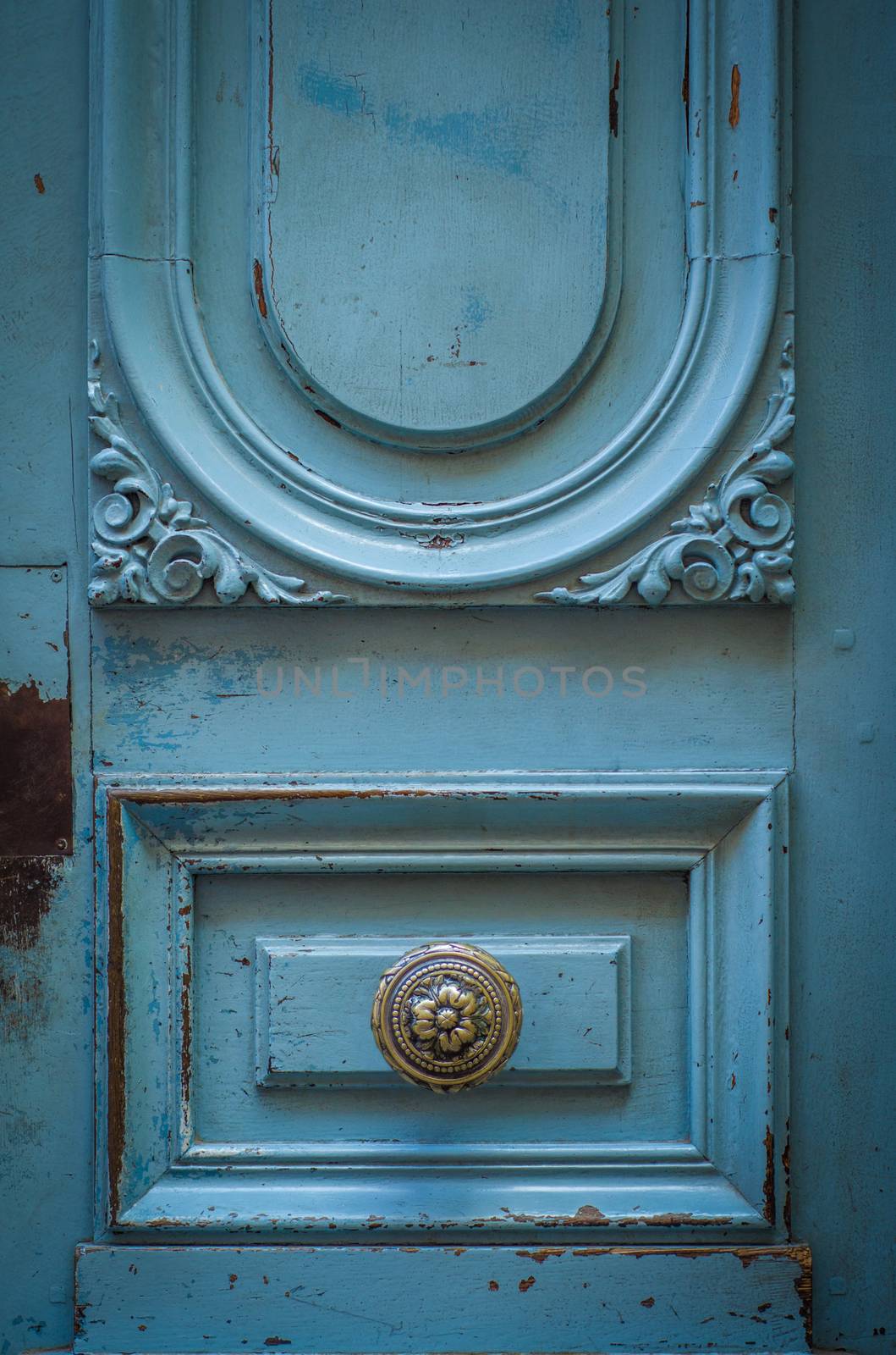 A Brass Door Knob On A Rustic Blue Door In Toulouse, France