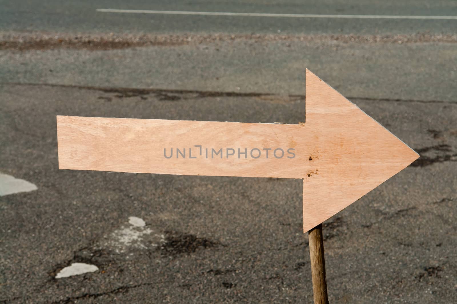 Empty wooden sign with a direction arrow text can be added