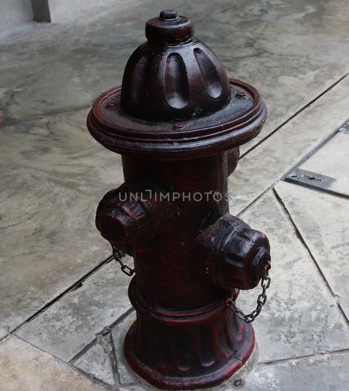 Antique fire hydrant made from metal installed on street for fire security.                       