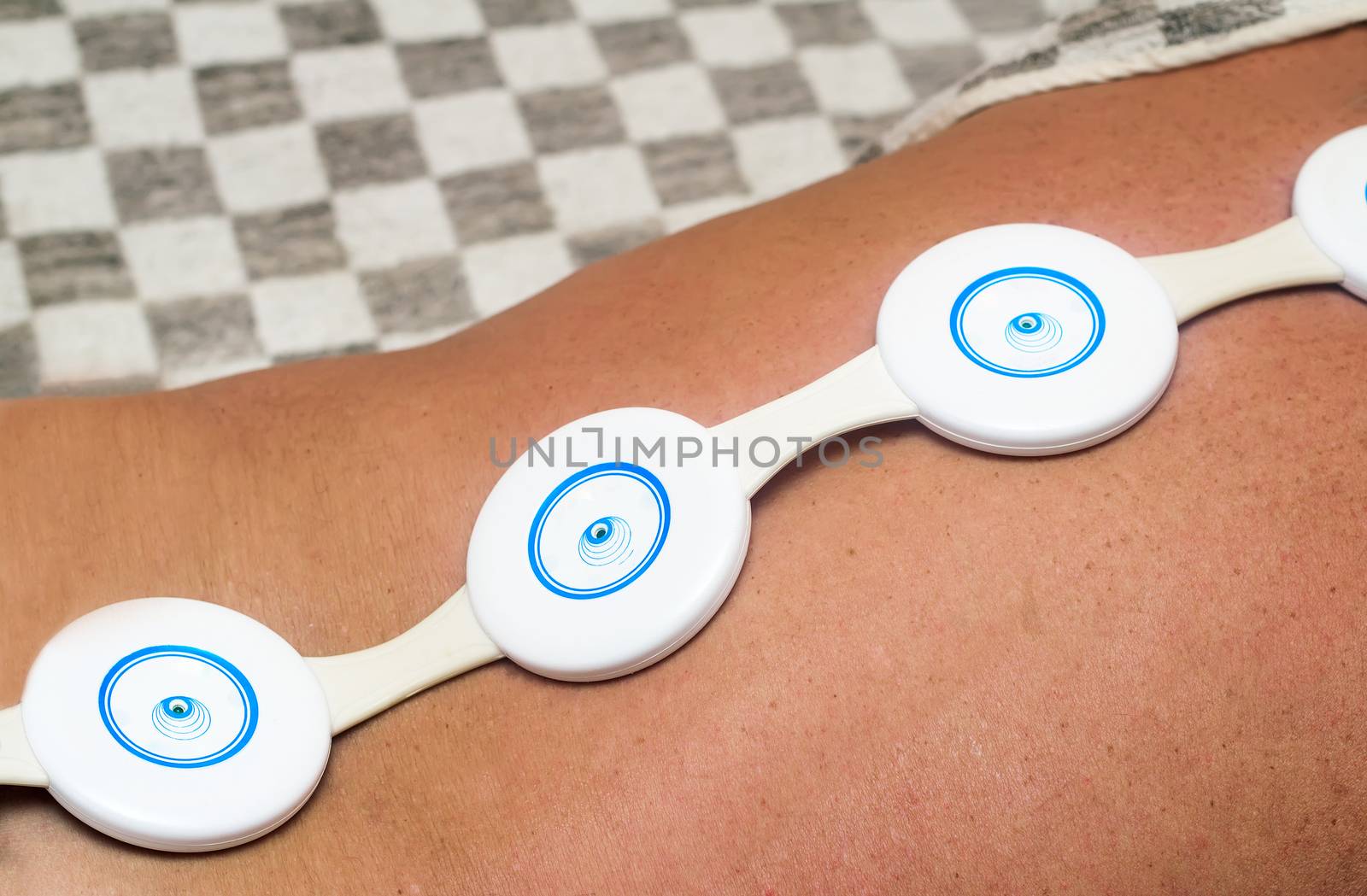 Portable and easy to use physiotherapy device for the magnetic therapy at home. The treatment of the patient with disease of the spine.