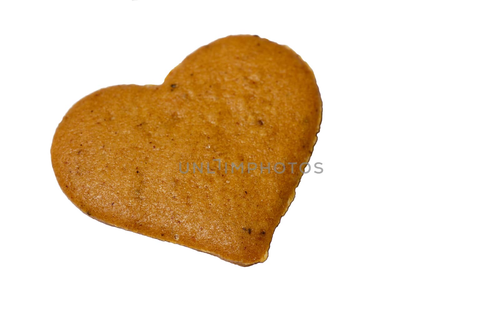Photo of a gingerbread cookie isolated on white background. Located at a top-left corner of a screen. Food photography.