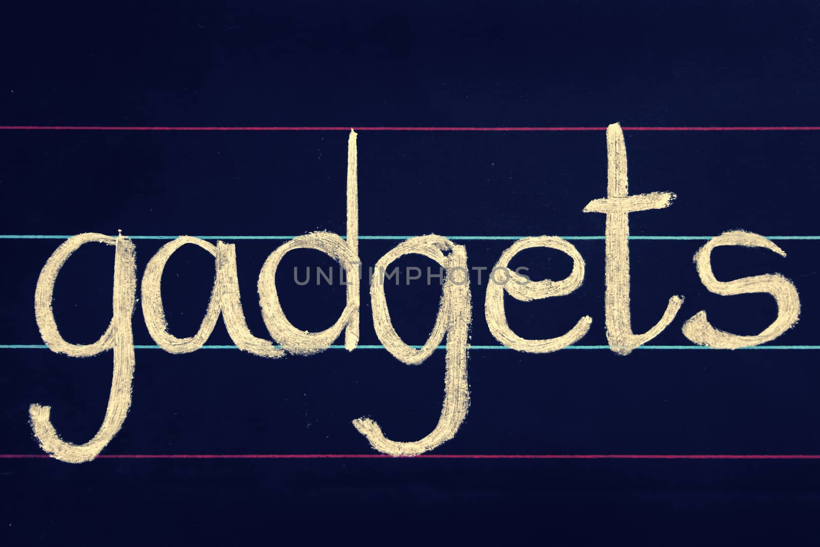 gadgets phrase handwritten on blackboard by yands