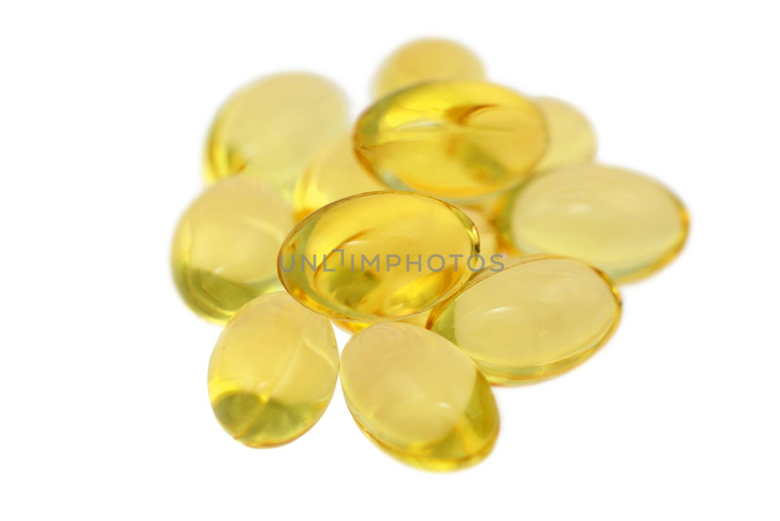 Photo of a heap offish oil capsules isolated on white background. Objects photography. Medicine and healthcare.