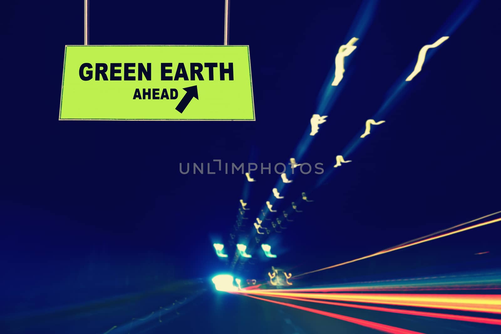 A Notice Board On A National Highway tunnel  Showing Green earth Ahead Concept