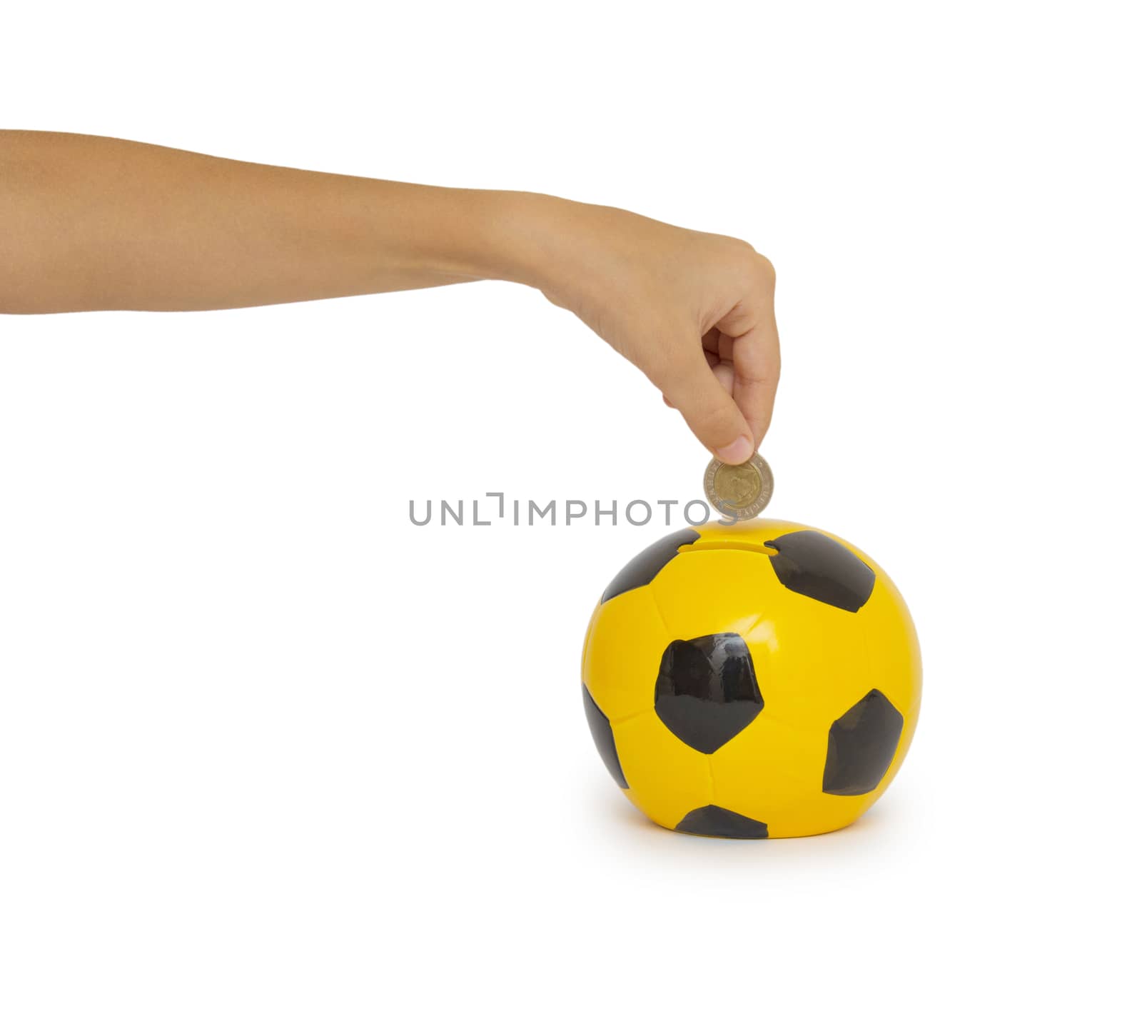 Closeup of woman's hand inserting coin in moneybox

