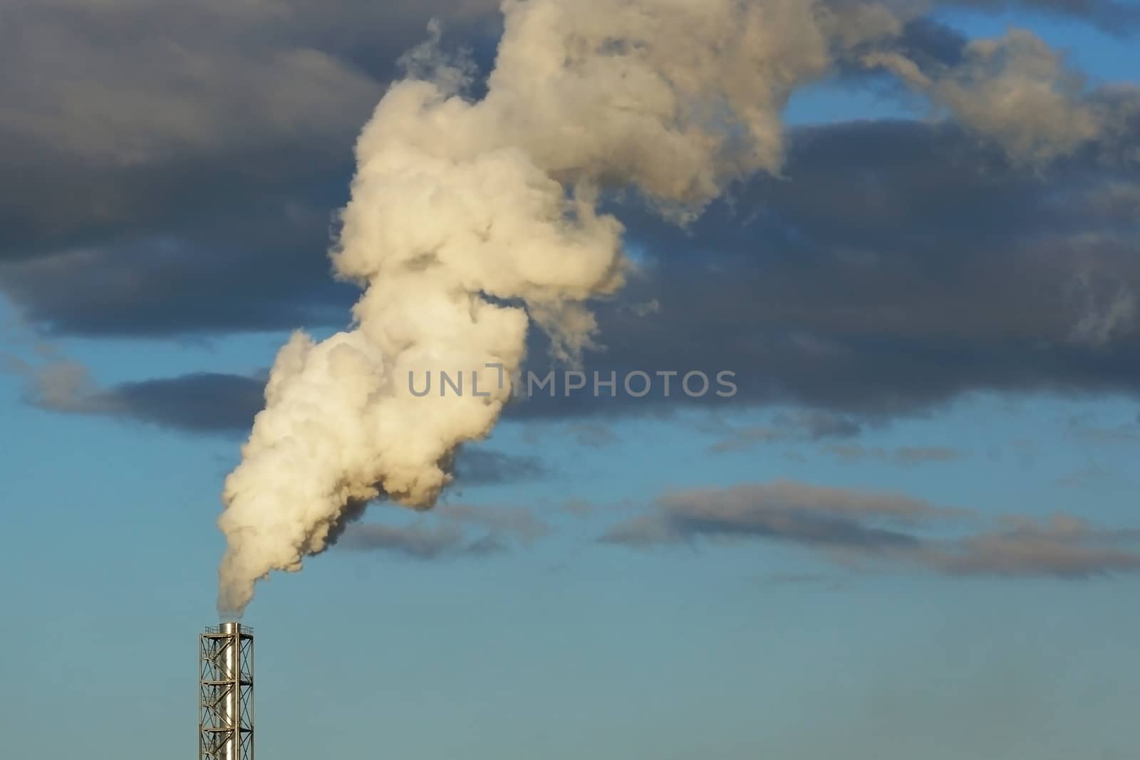 smoke from a chimney on a blue sky by dk_photos