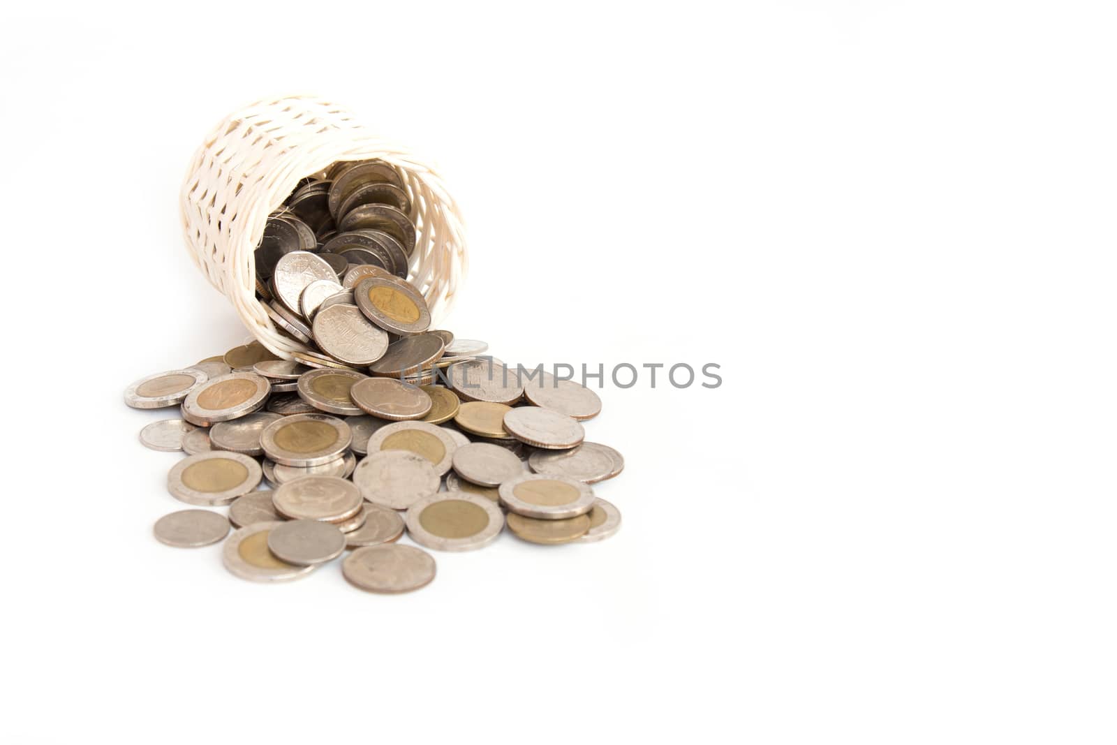 Wooden Basket handmade and stack of coin isolated on white background