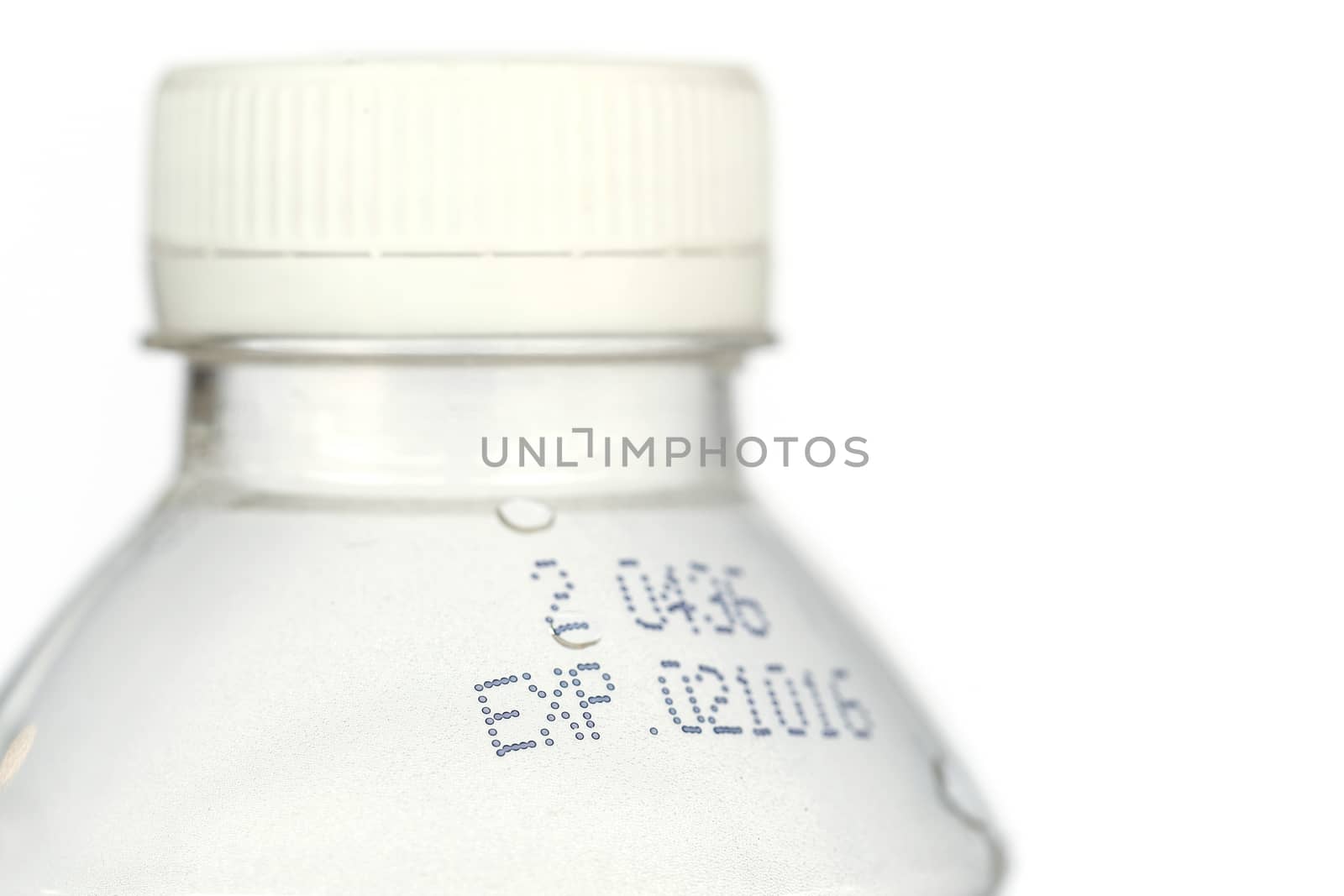 Close up expire date on plastic bottle isolated on white background