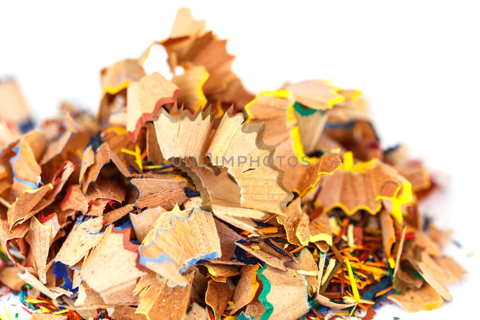 Close up colorful pencil shavings isolated on white background