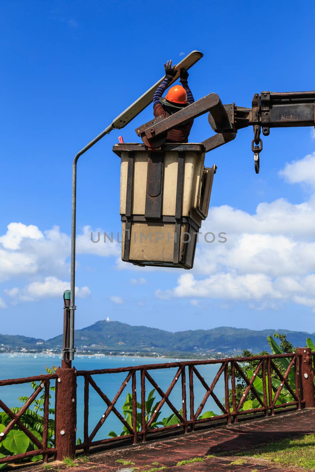 Electrician Man changing lamp by nanDphanuwat