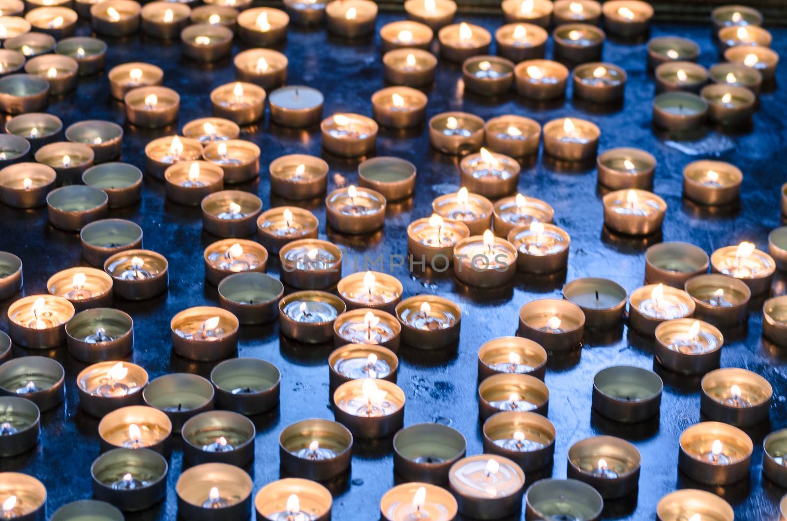 Candles donation in a church  in memory of the survivors. 