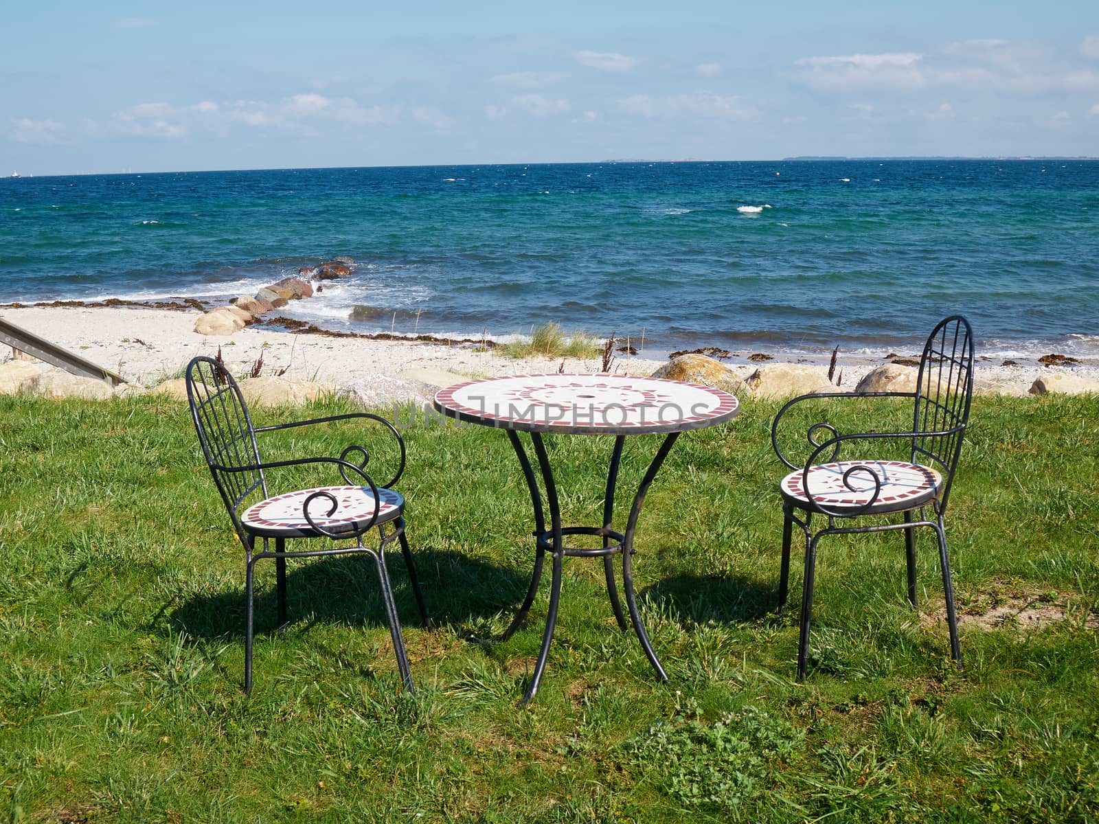 Chairs and table relaxing seating corner on a beautiful beach