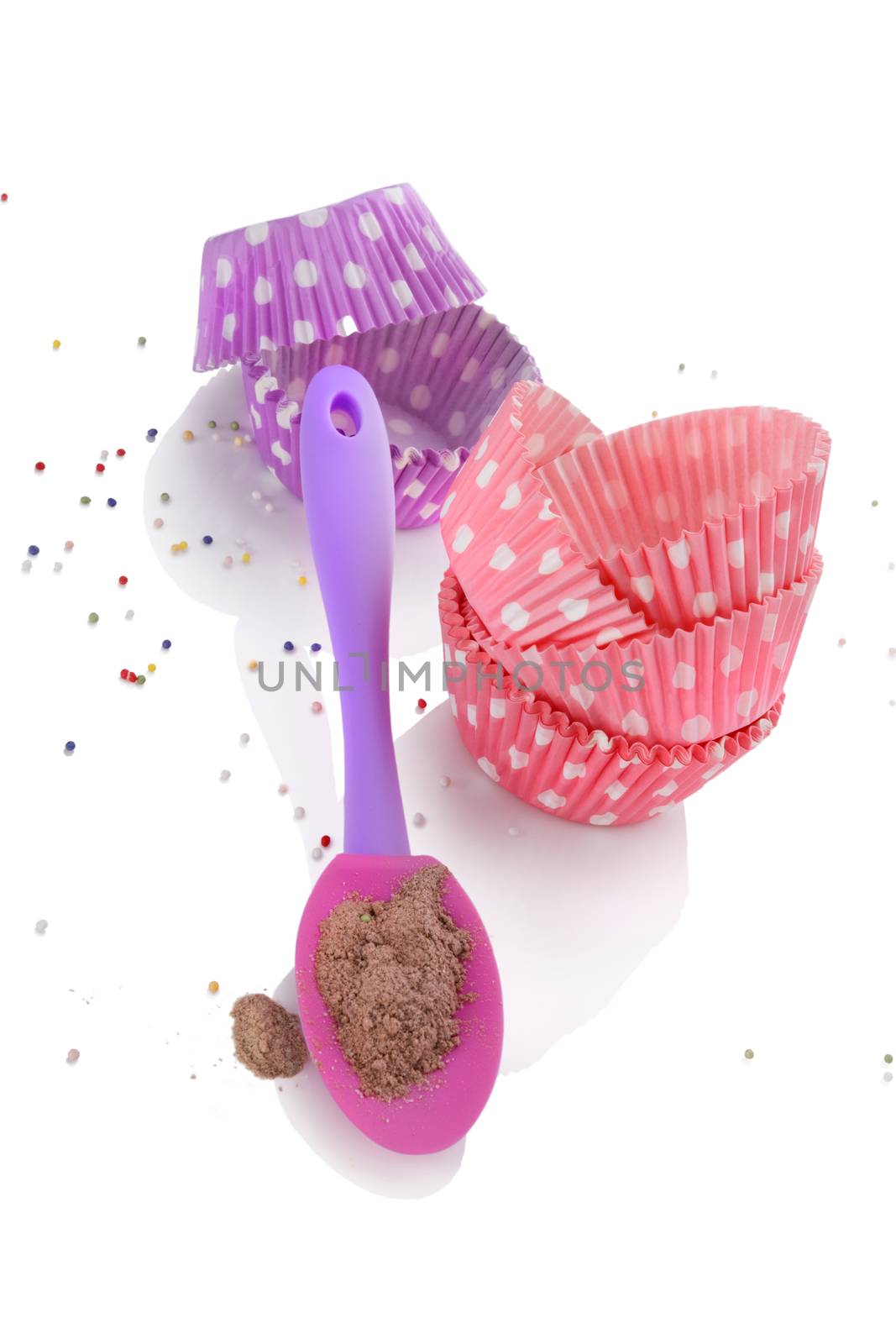 Contemporary baking set. Baking forms, baking mixture and baking garnish isolated on white background.