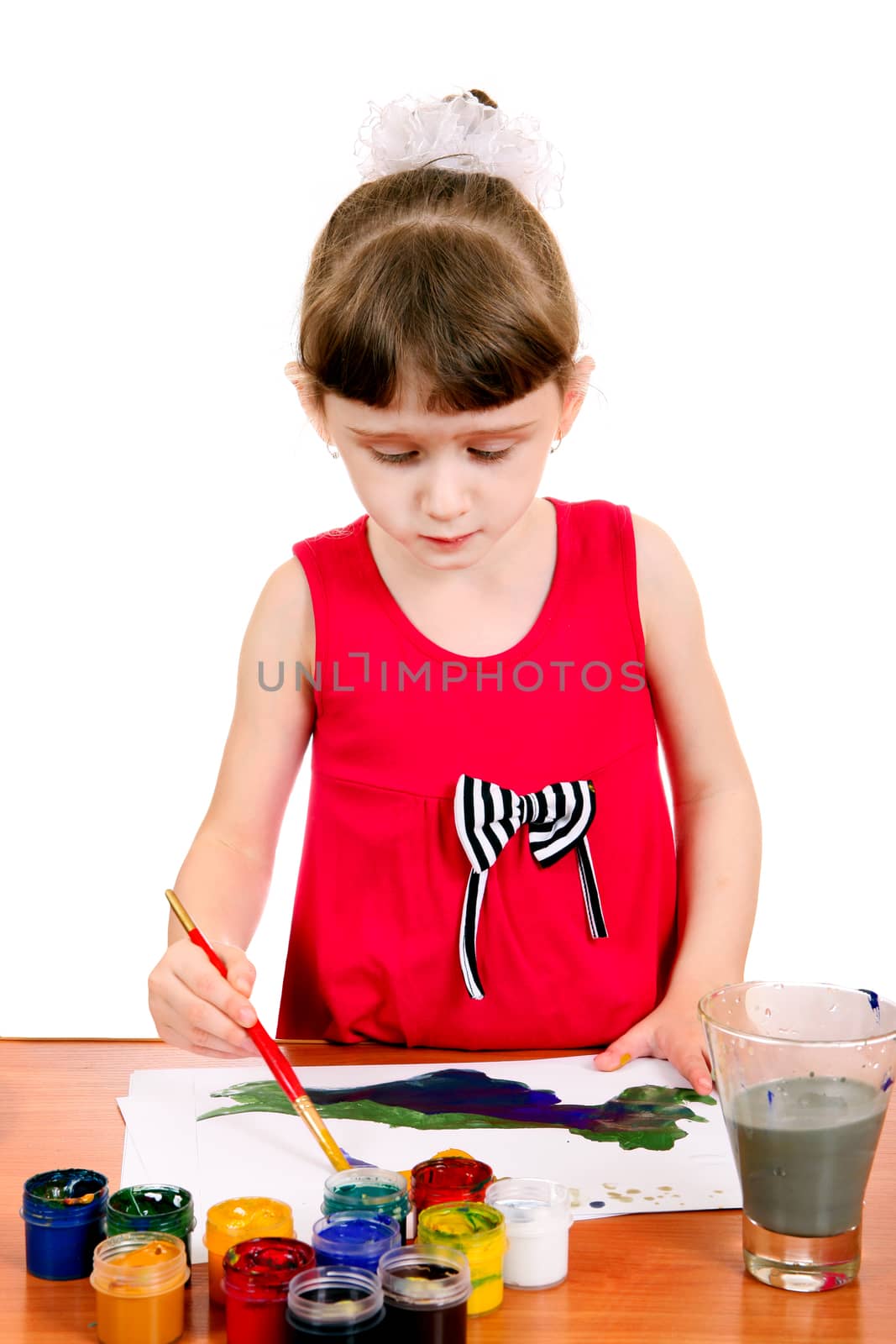 Concentrated Little Girl Drawing Isolated on the white background