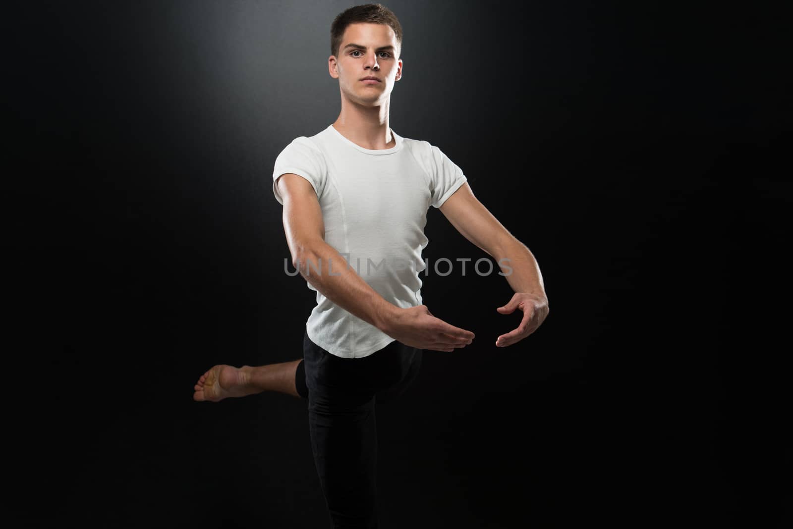 Young Beautiful Dancer Posing On A Studio Background by JalePhoto