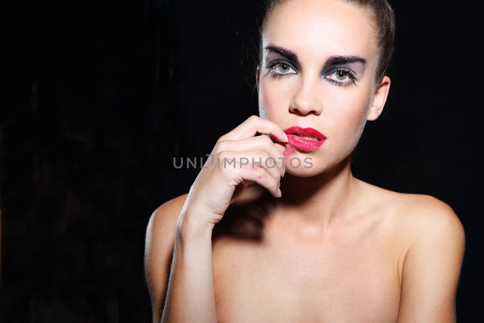 Sad woman in makeup smudged, smeared red lipstick by robert_przybysz