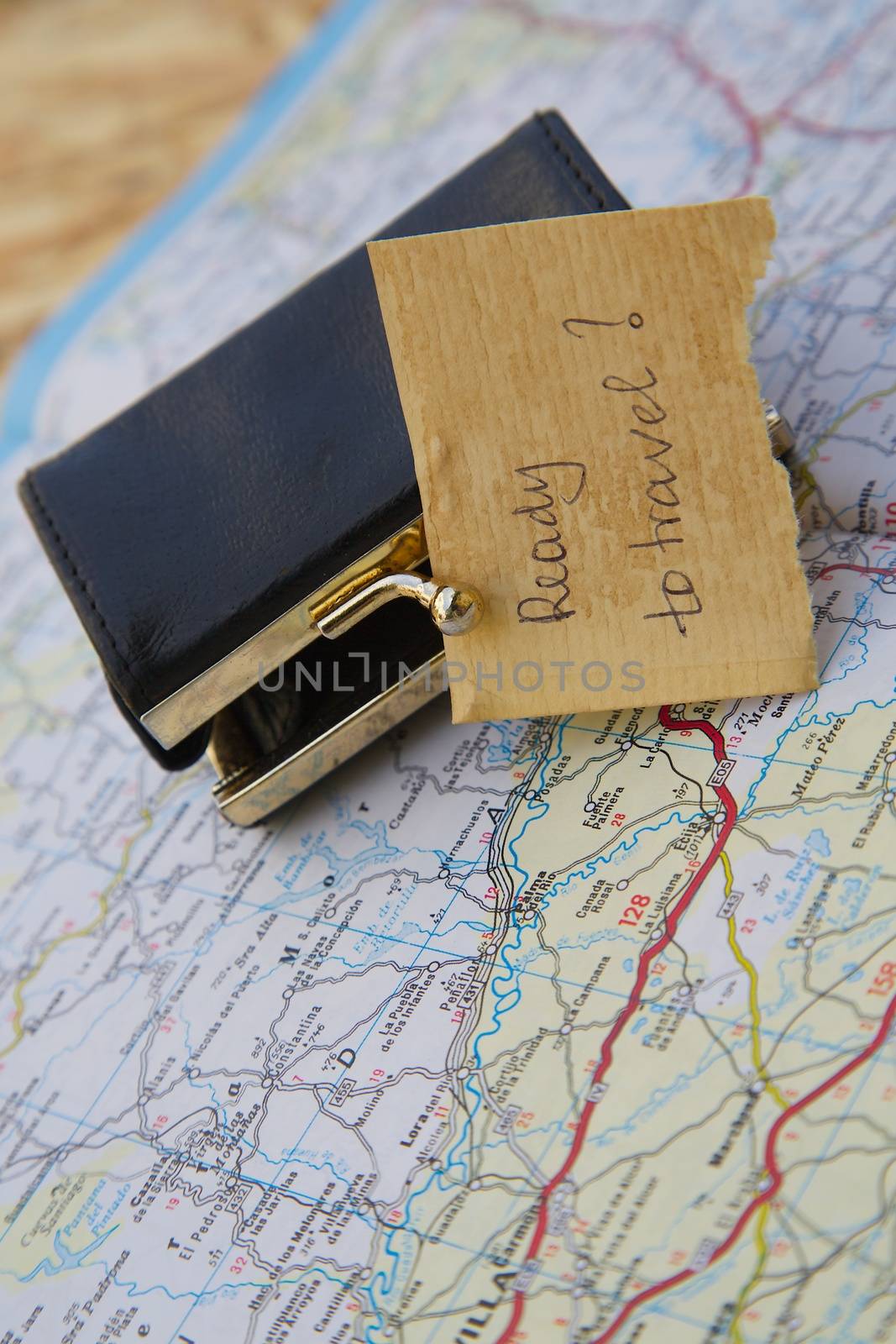 Message left at a small wallet:"Ready to travel?" Items are placed on the road map