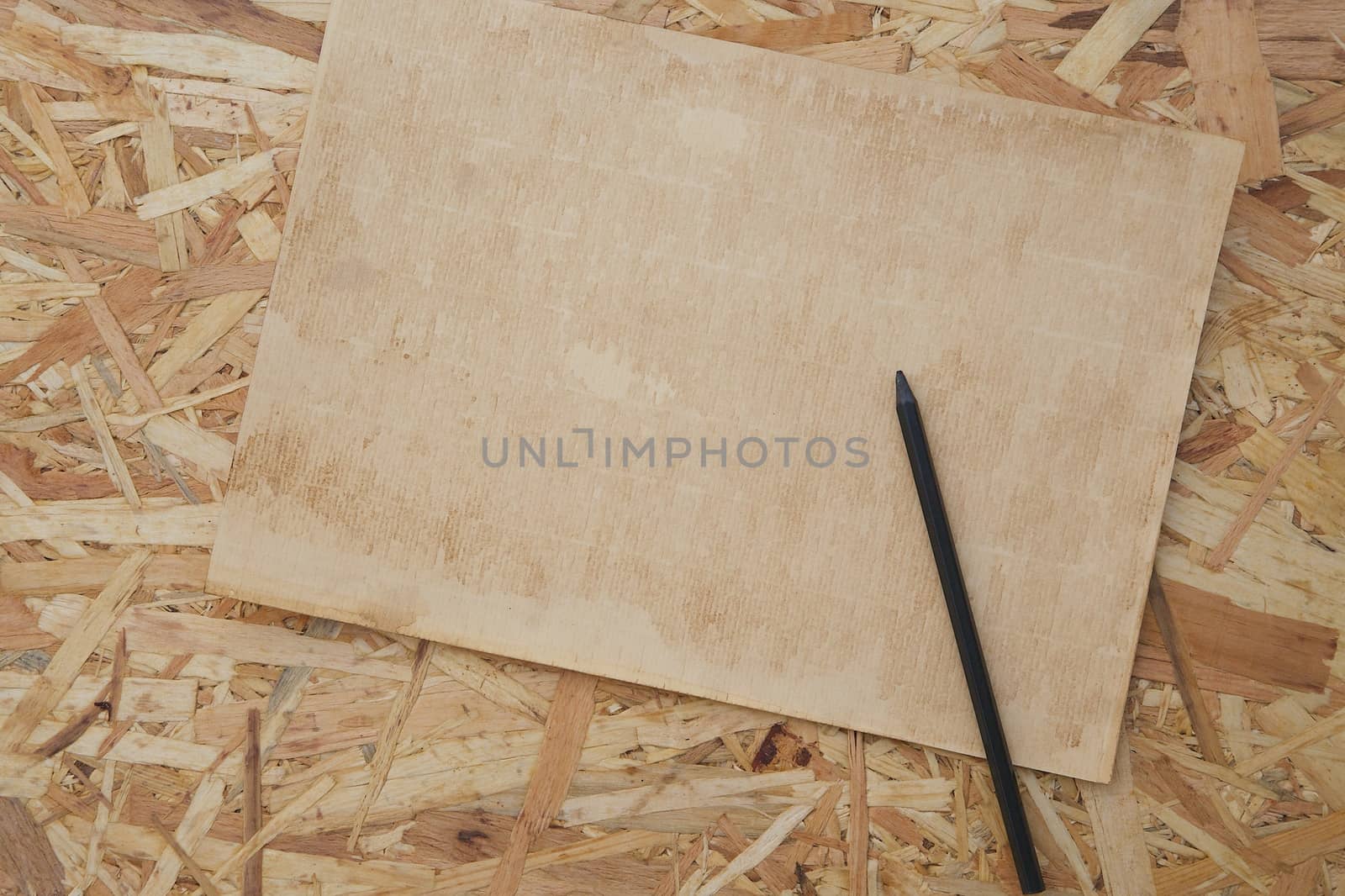 A sheet of old carton paper and a pen by tolikoff_photography