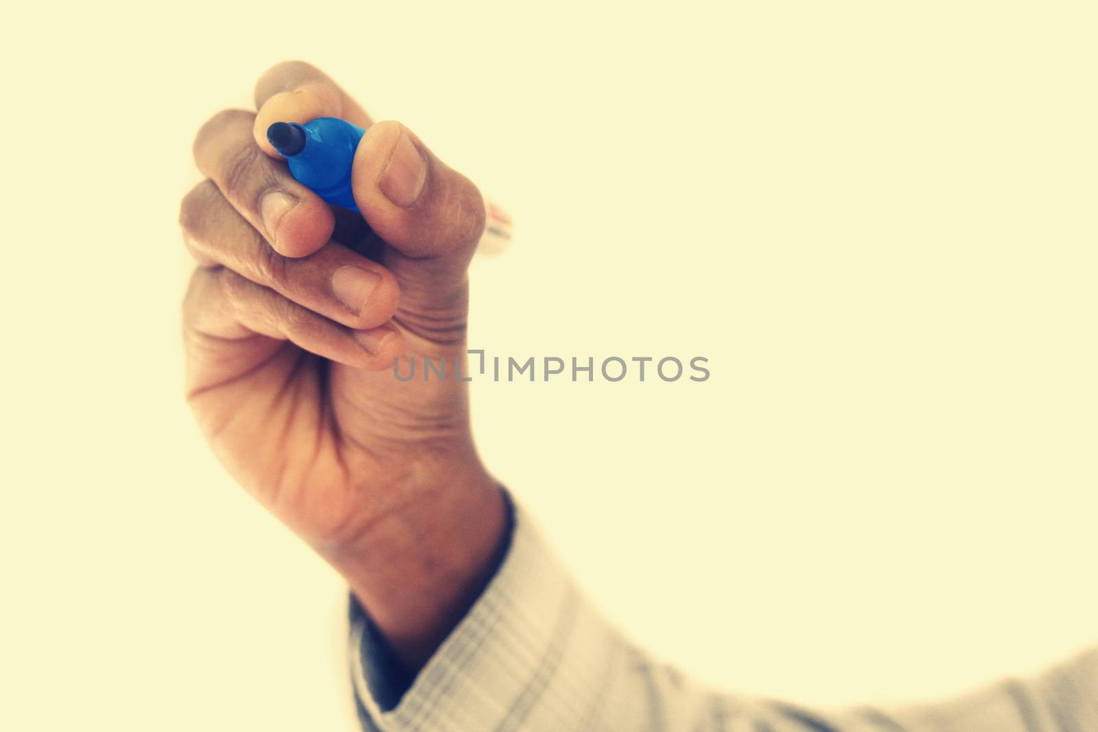 Hand with pen isolated on white