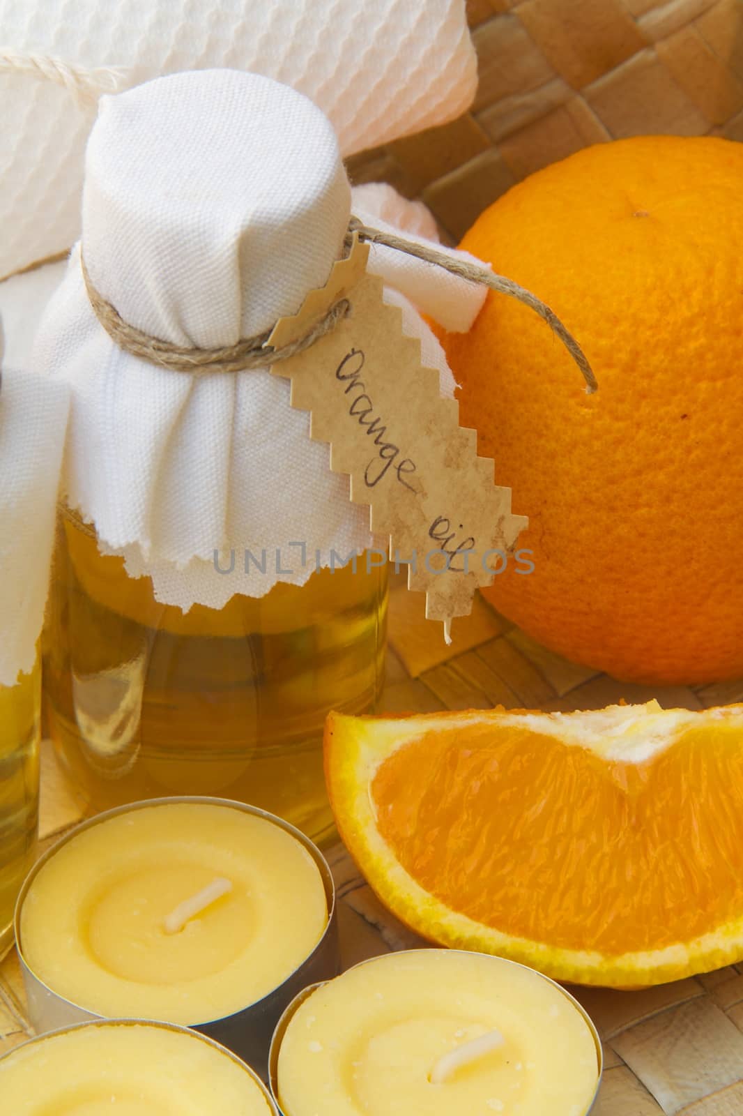 Bottle of orange oil by tolikoff_photography