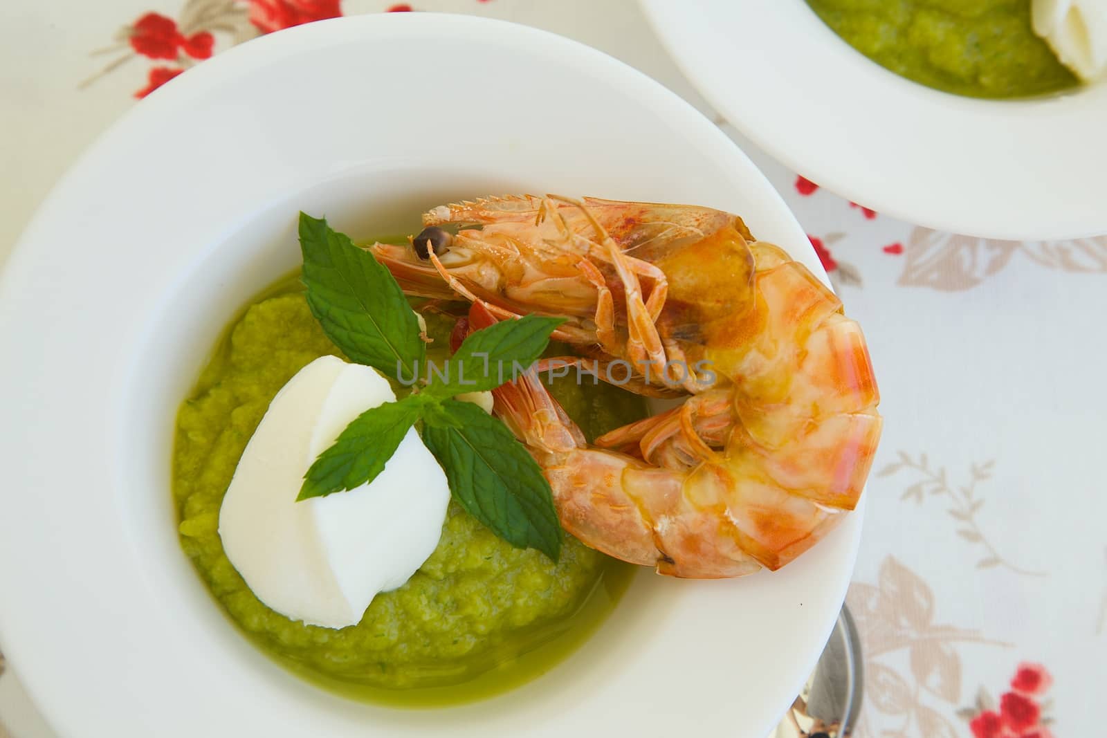 Healthy lunch soup-zucchini cappuccino soup with shrimps by tolikoff_photography