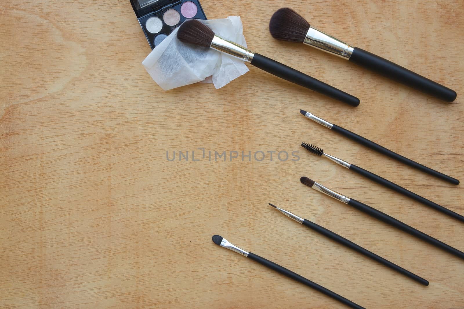 Makeup brushes  set on a wooden surface by tolikoff_photography