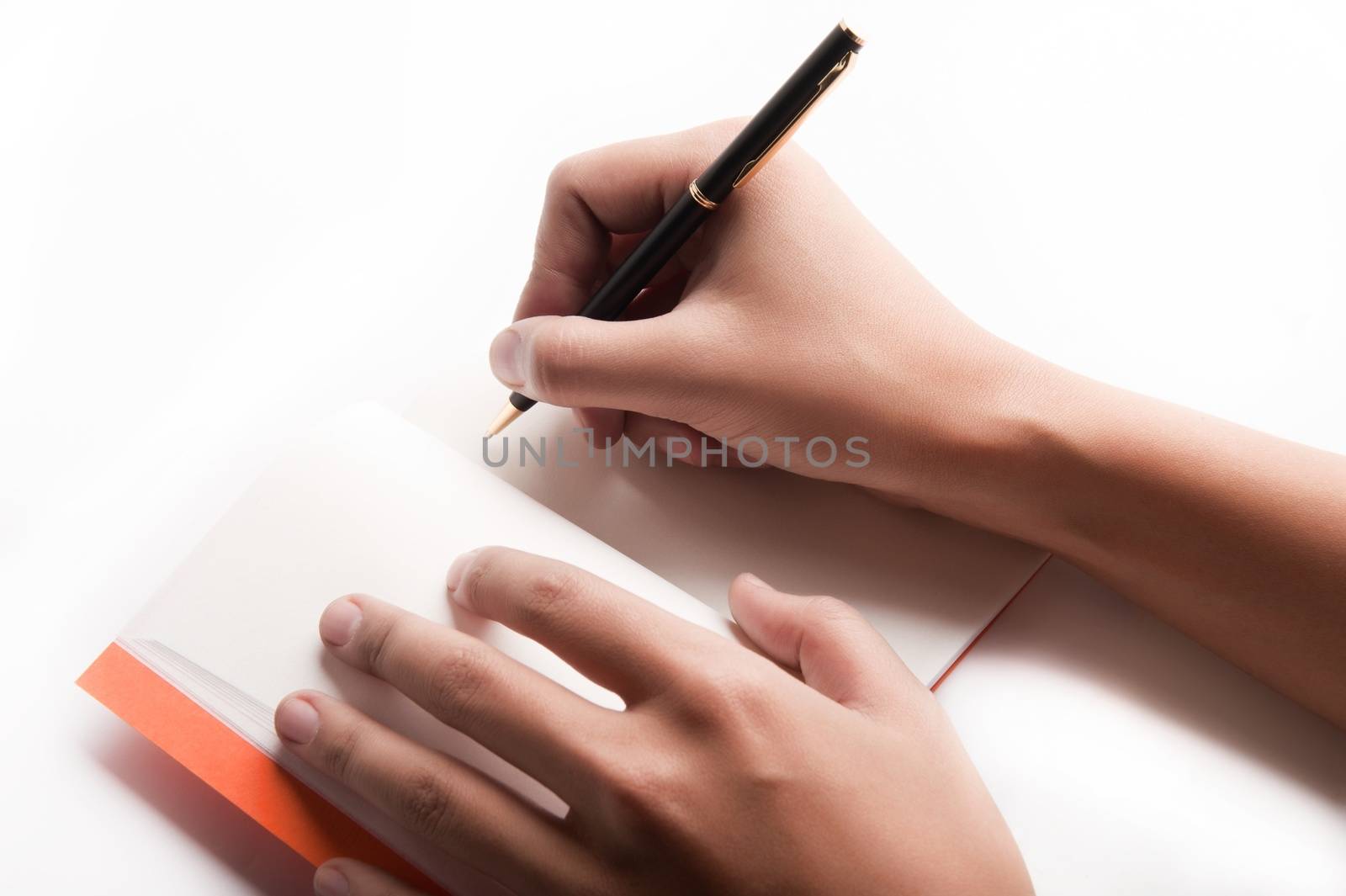 Horizontal close-up of isolated on a white background woman's note-taking hands