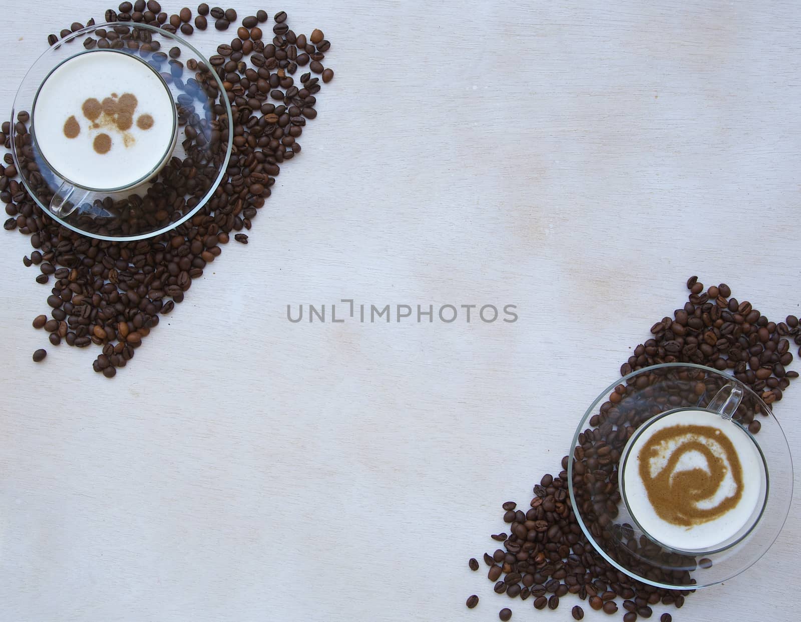 Two glass cups of cappuccino. Top view. Free space for a text