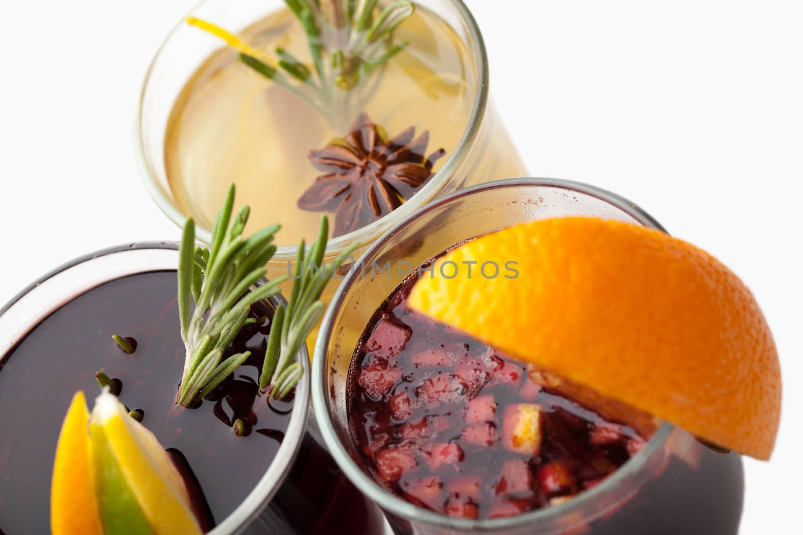 Variety of traditional winter sweet hot alcohol drinks mulled red wine  glintwine and  white rum with orange, spices, cinnamon, rosemary, anise