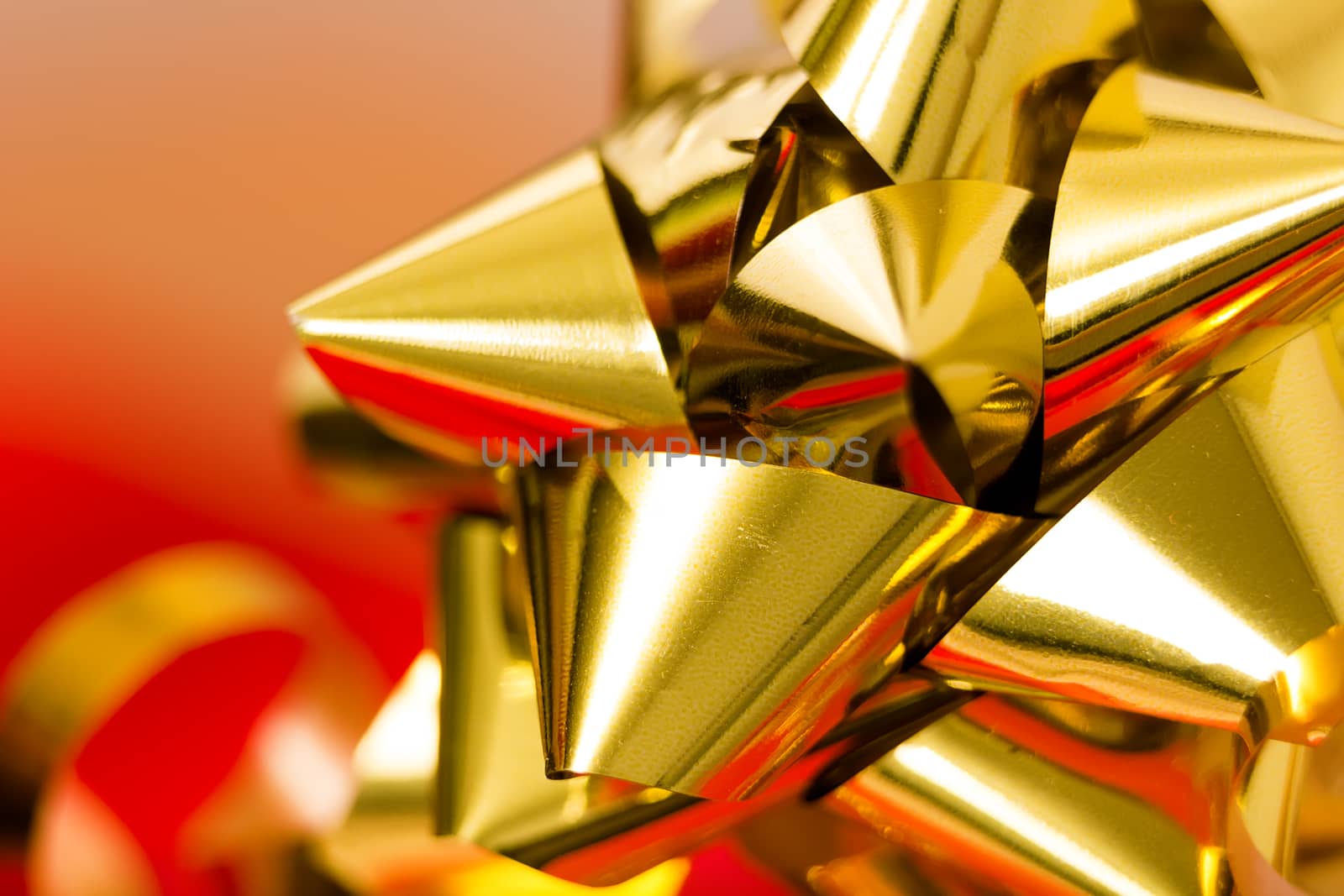 Festive golden bow on a blurred background. macro by pzRomashka