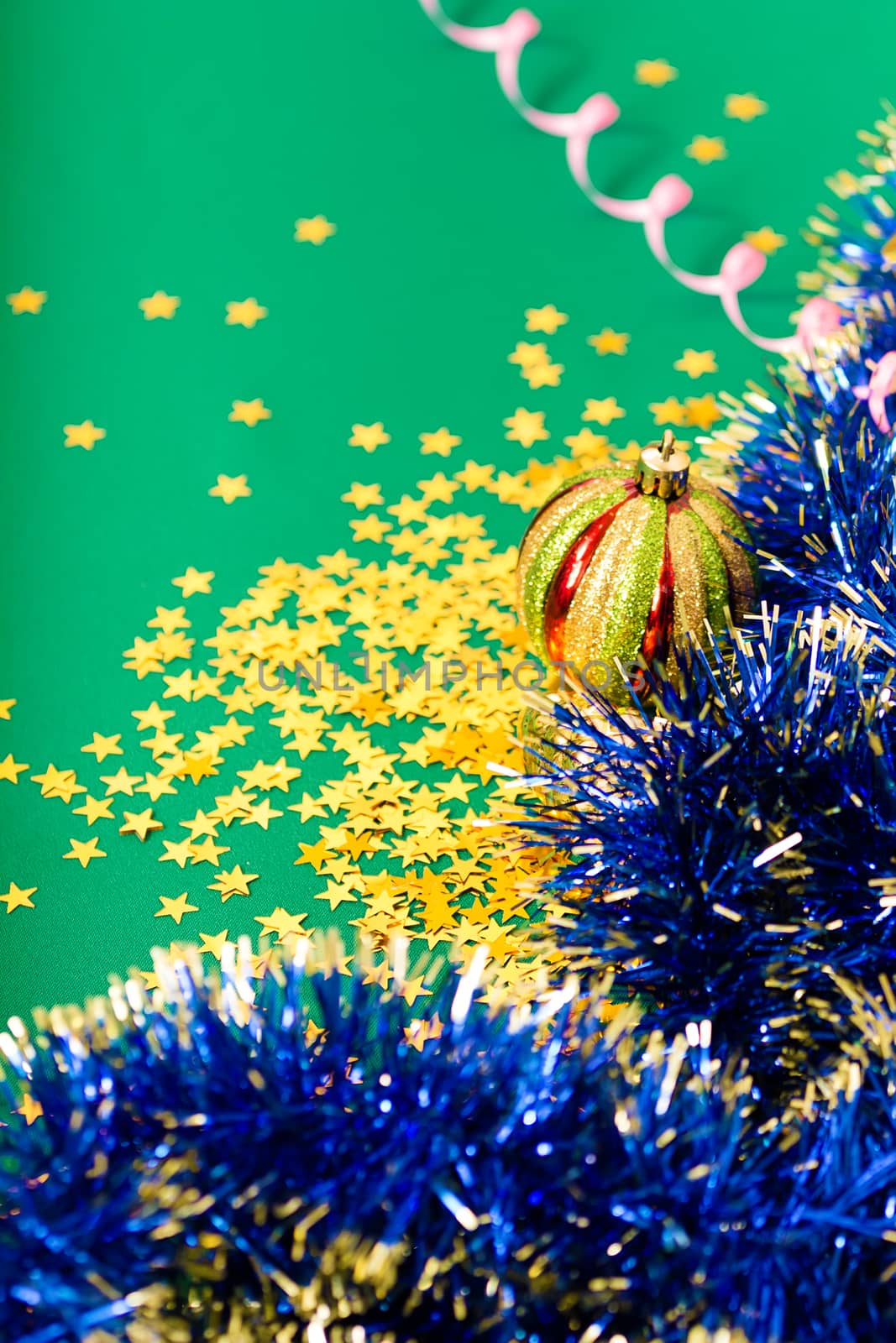 Christmas card. Stars and Christmas decorations on a green cloth