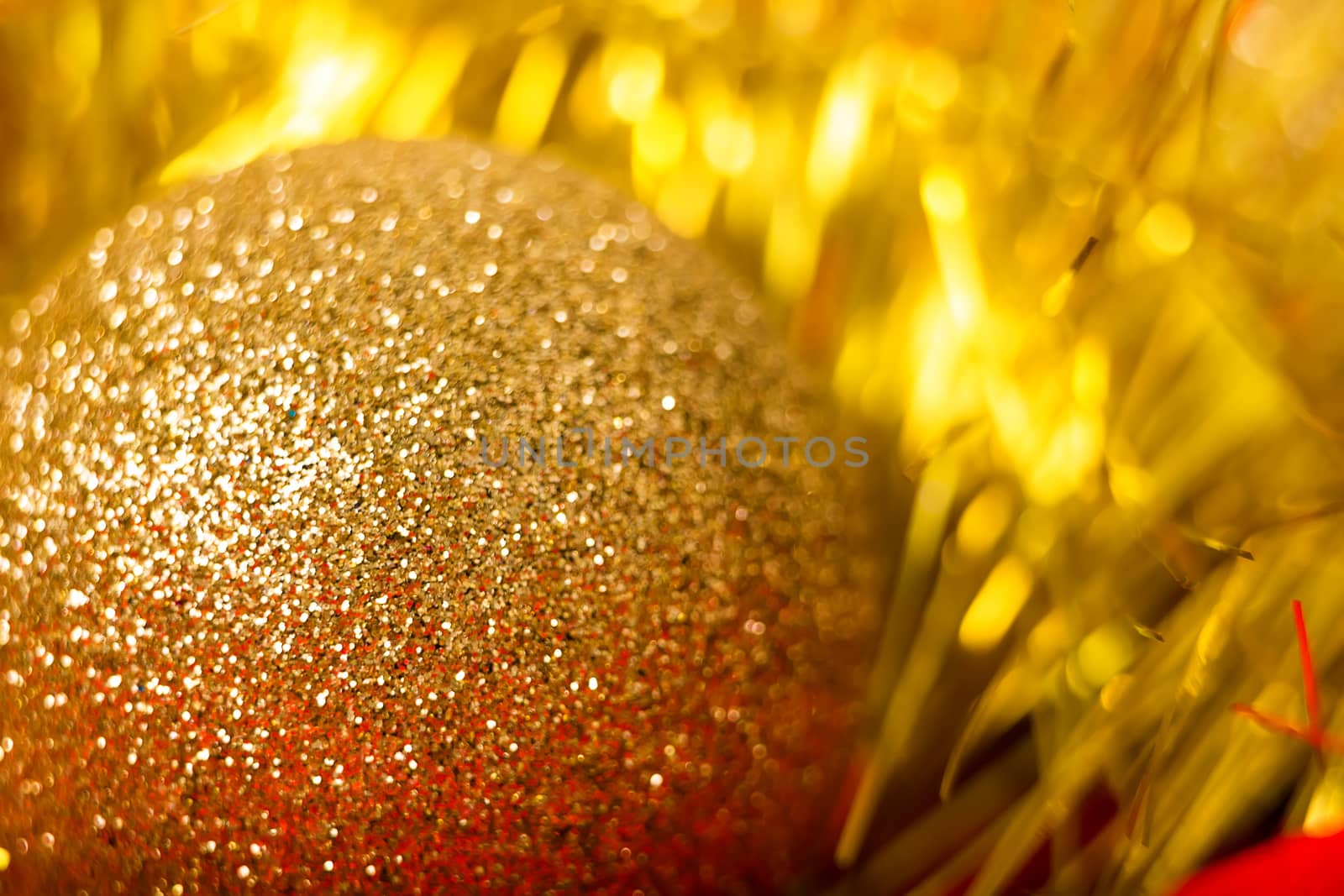 Christmas golden ball and tinsel. macro shooting