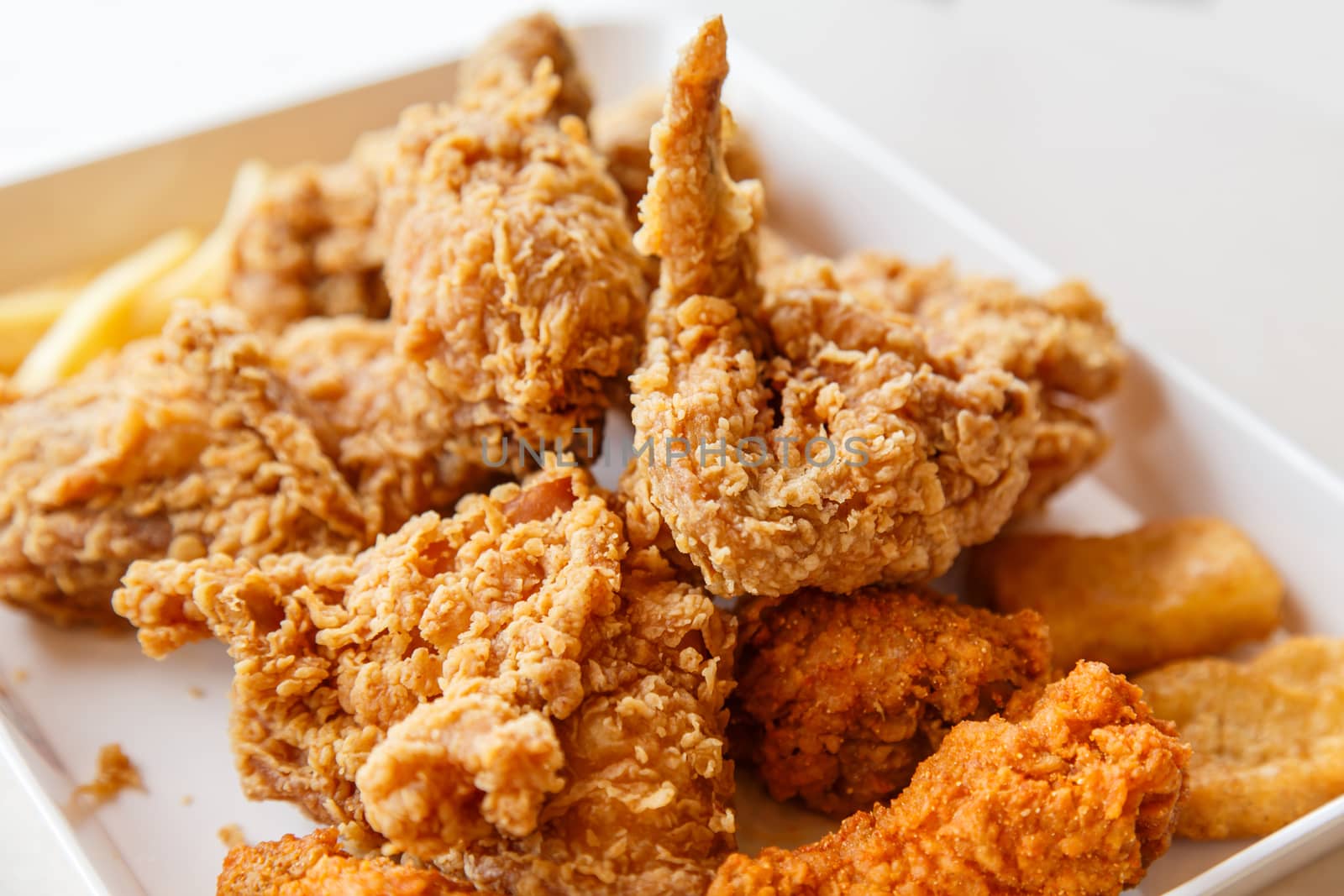 Fried chicken with chili sauce and tomato sauce