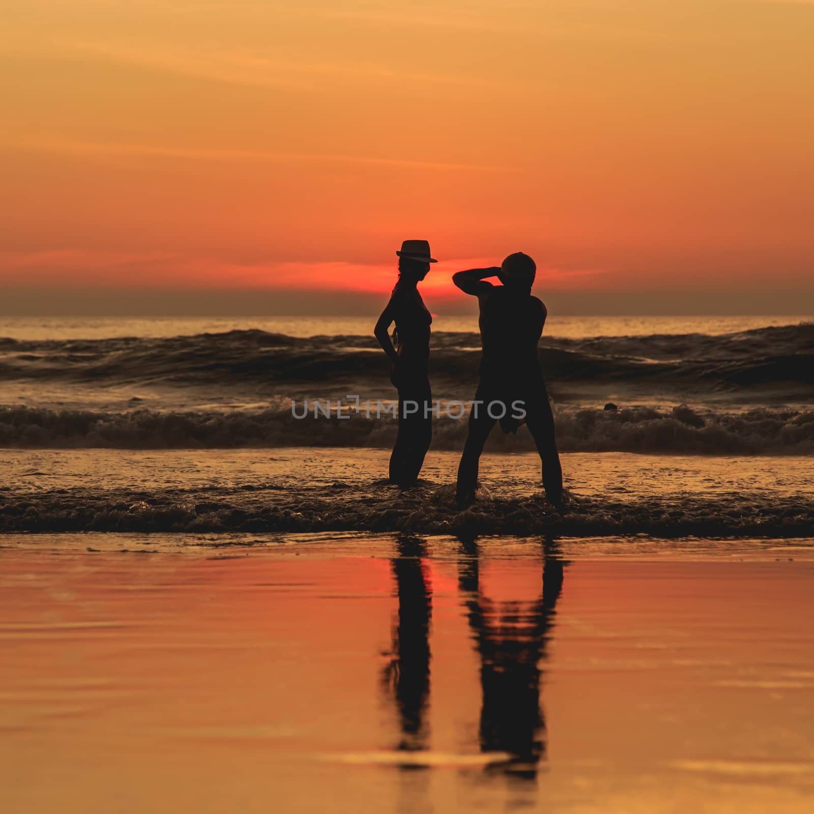 Silhouette of tourist at sunset beach in Phuket Thailand