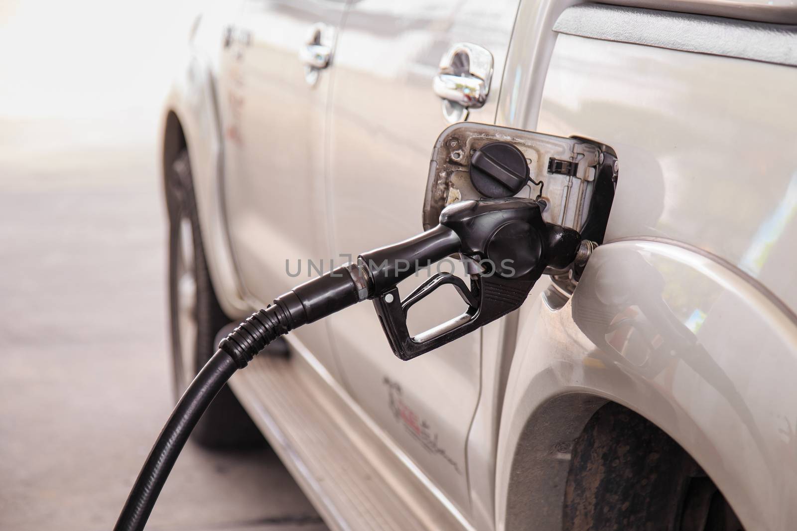 Close up car refuel by nanDphanuwat