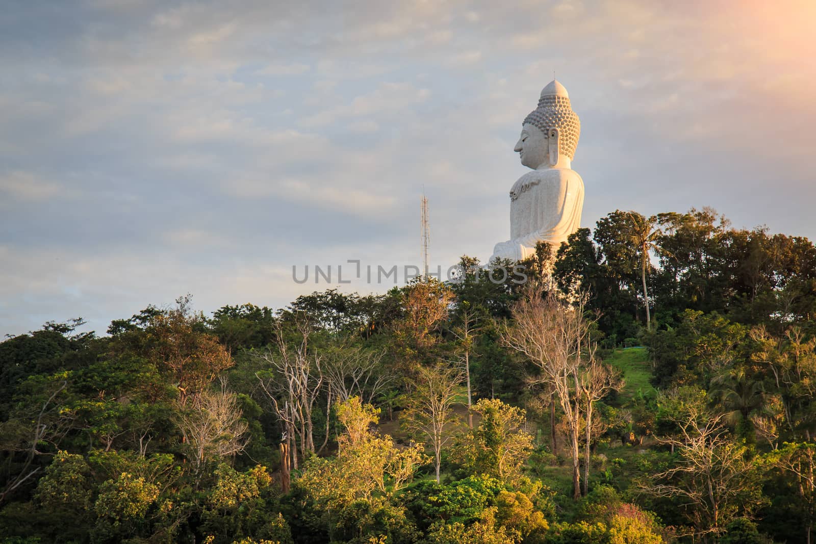 Big white buddha statue on mountain in Phuket