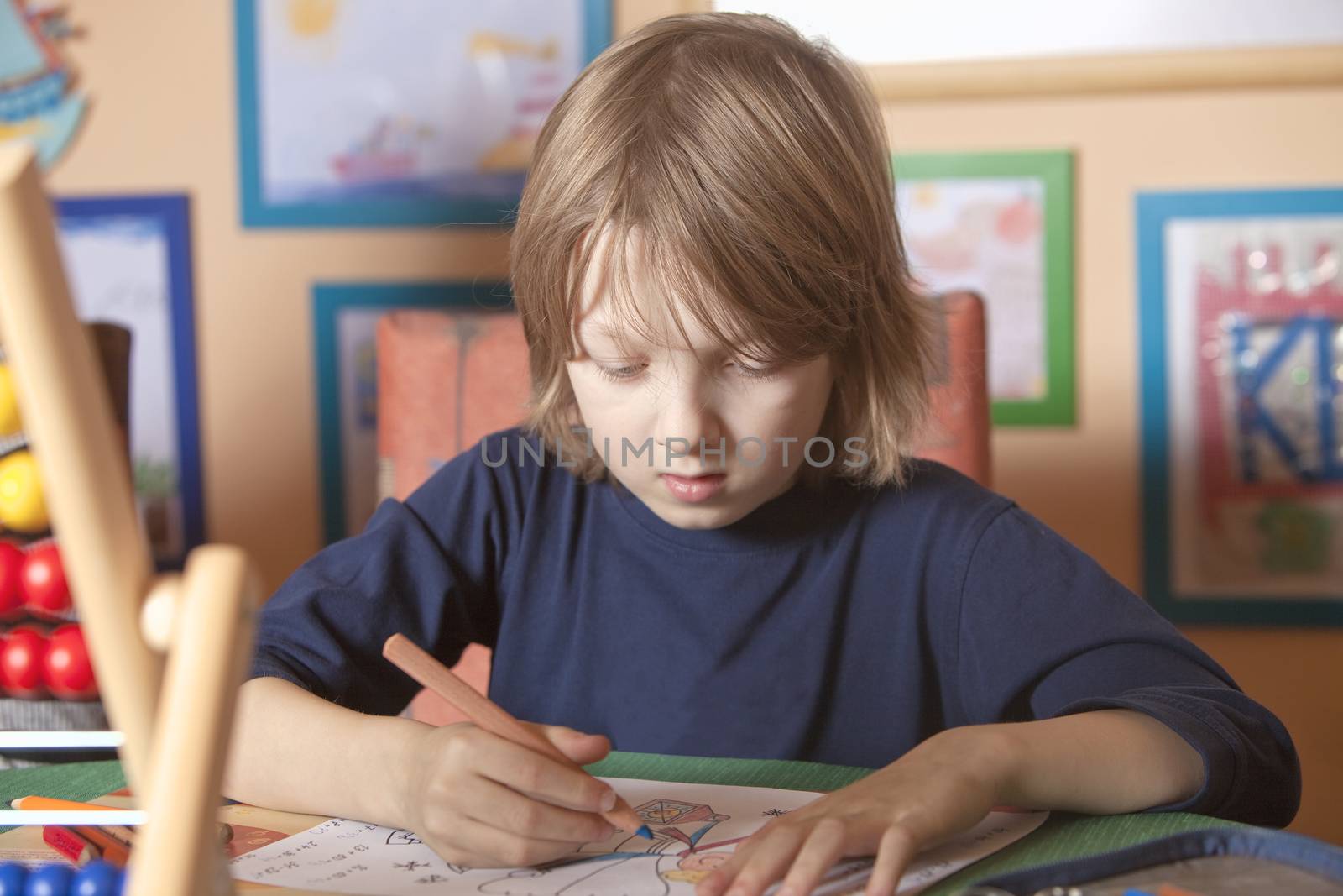 Boy Working on his Homework by courtyardpix
