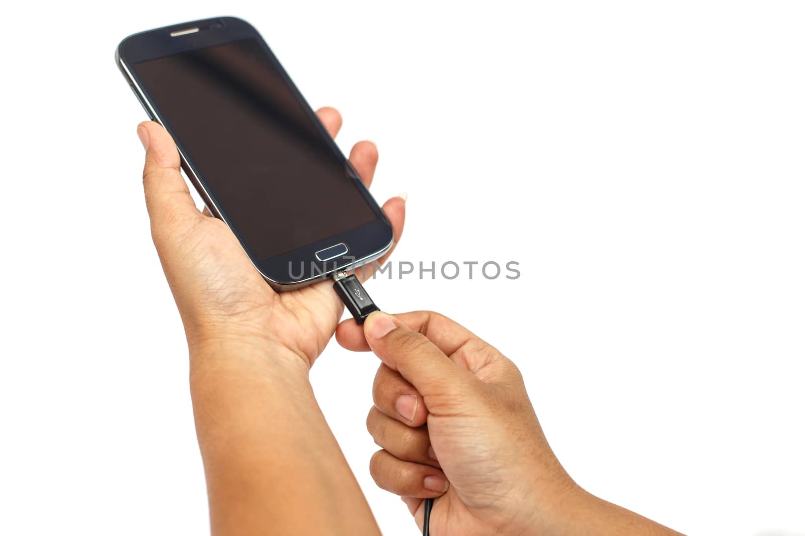 Hand holding smartphone and connect charger isolated on white background