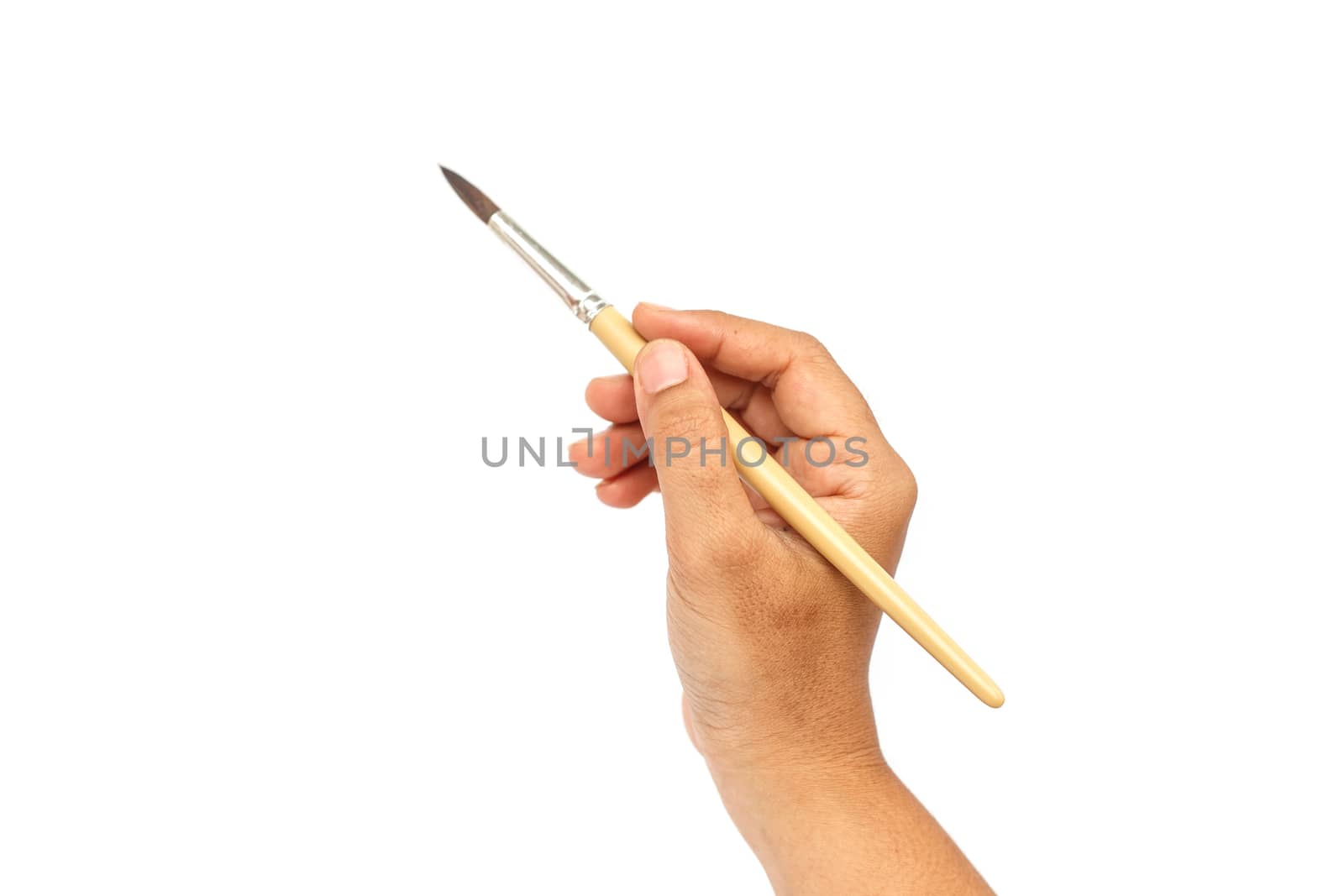 Hand holding paintbrush isolated on white background
