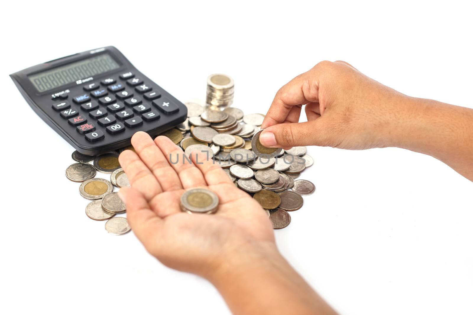 Close up hand count the coin with calculator isolated on white background