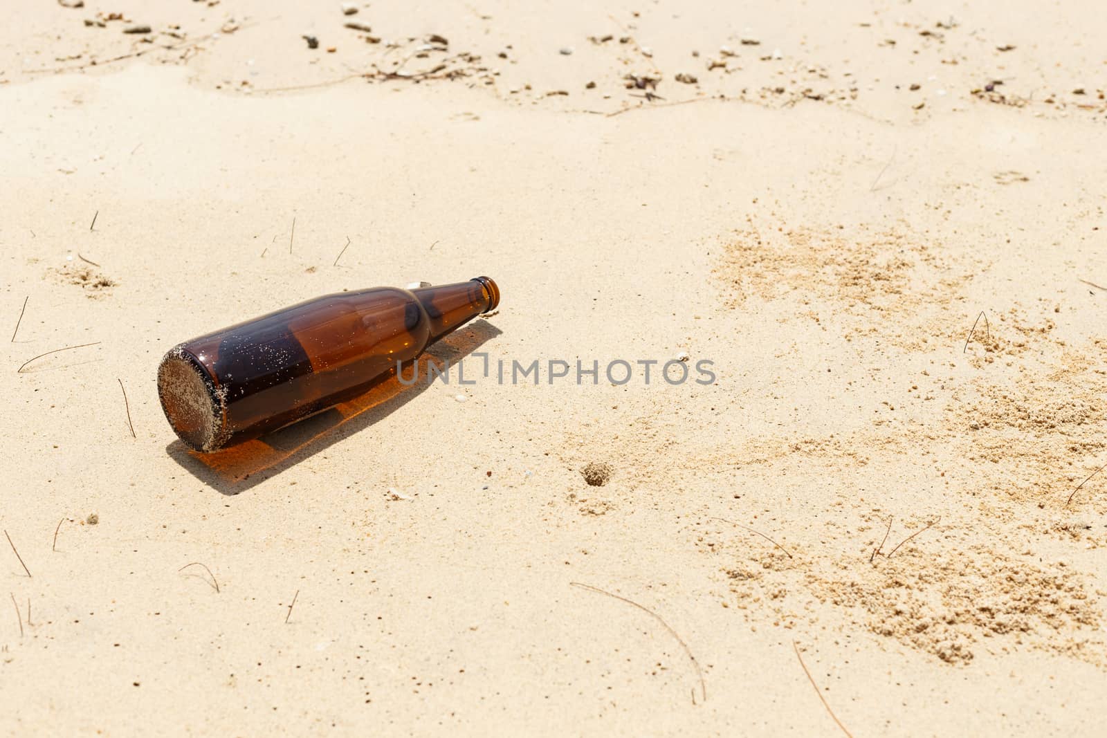 Glass bottle on the beach